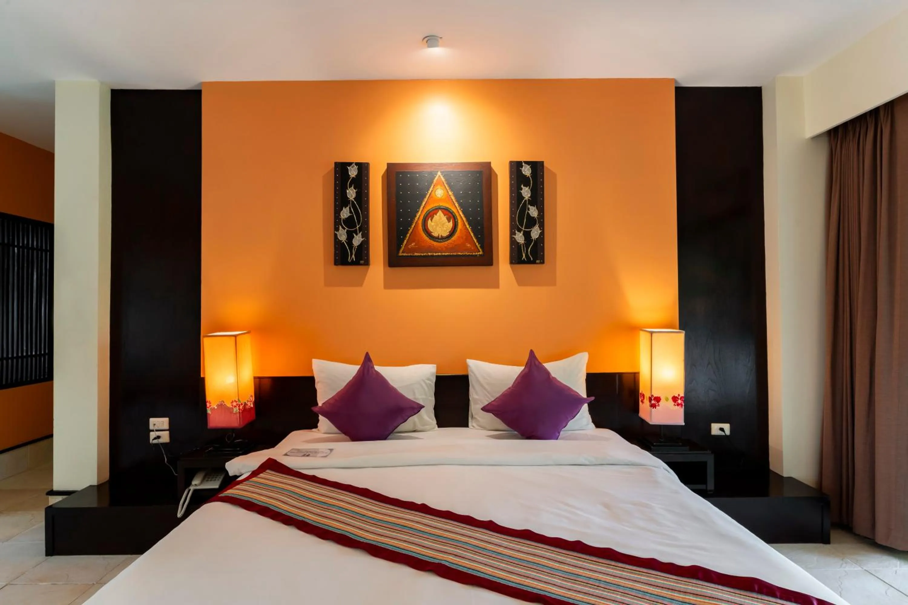 Bed in Baan Khaolak Beach Resort