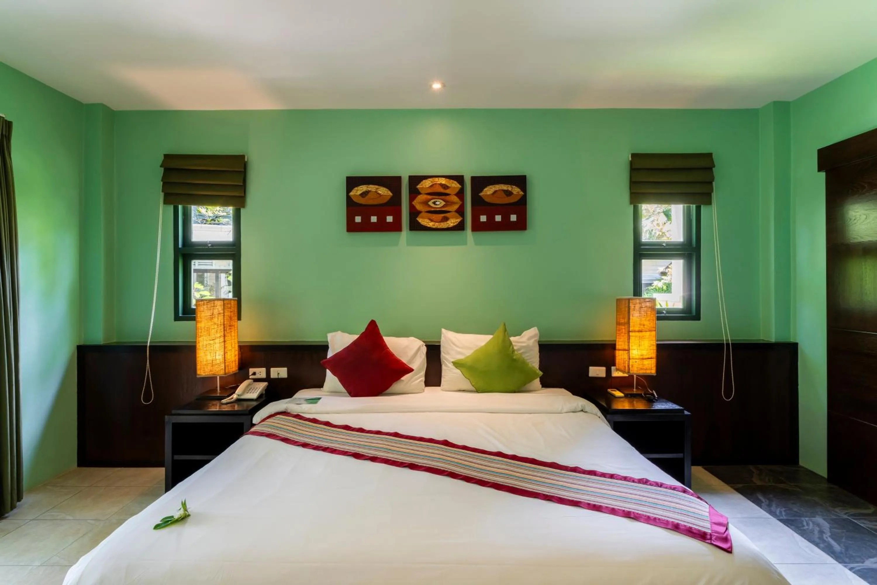 Bed in Baan Khaolak Beach Resort