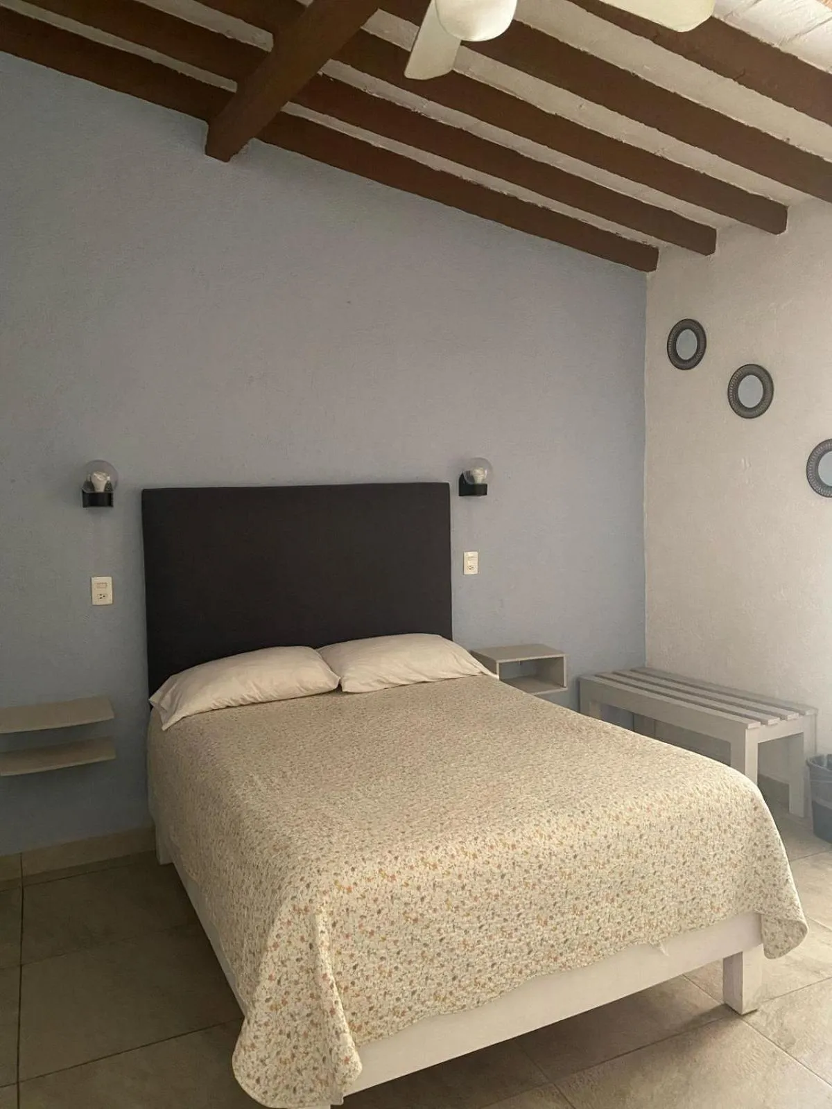 Bed in Posada Casa Topiltzin