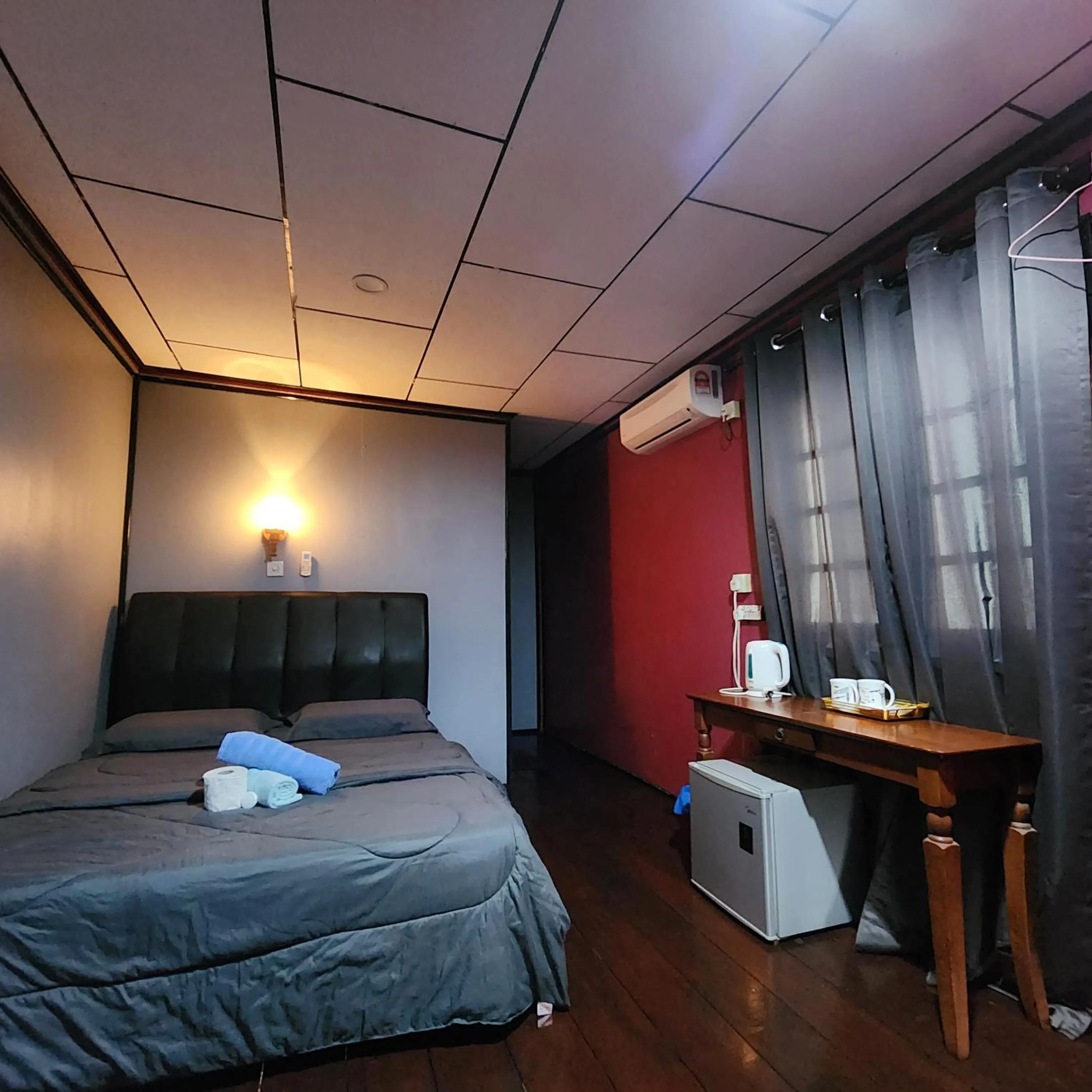 Bed in Permai Chalet Tioman