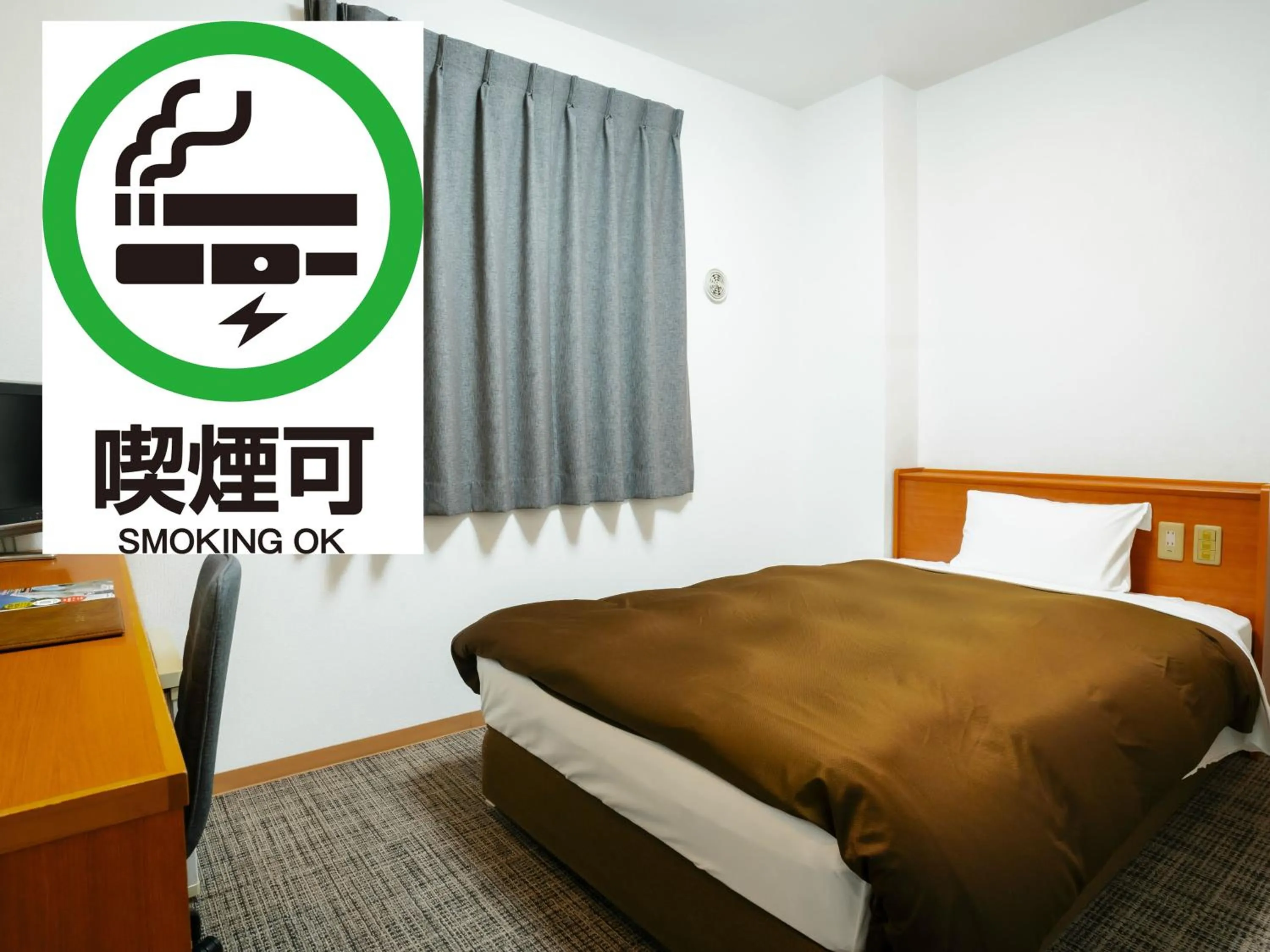 Bed in Kumamoto Ichibamae Business Kurenai Hotel