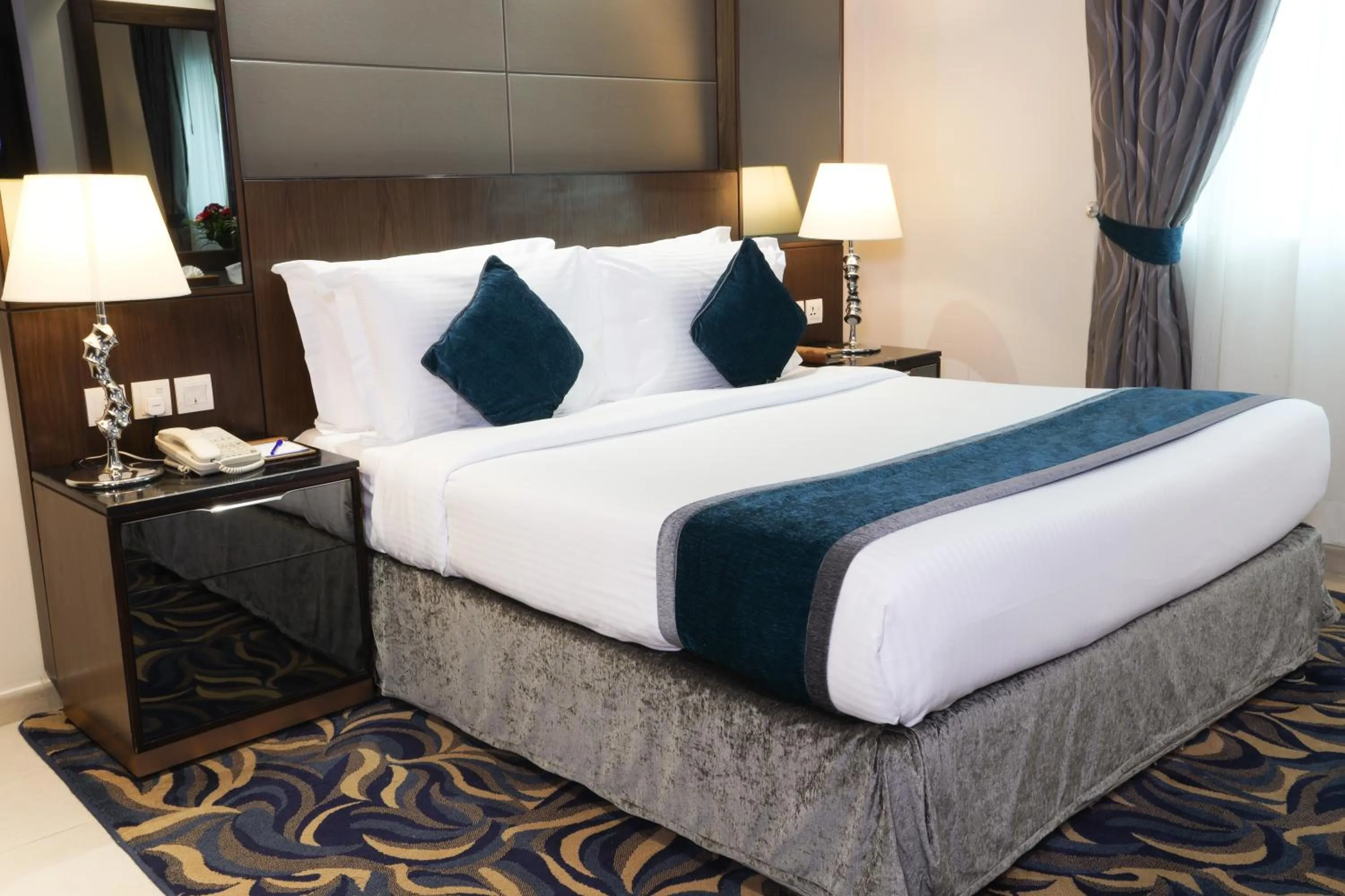 Bed in Omega Hotel Dubai