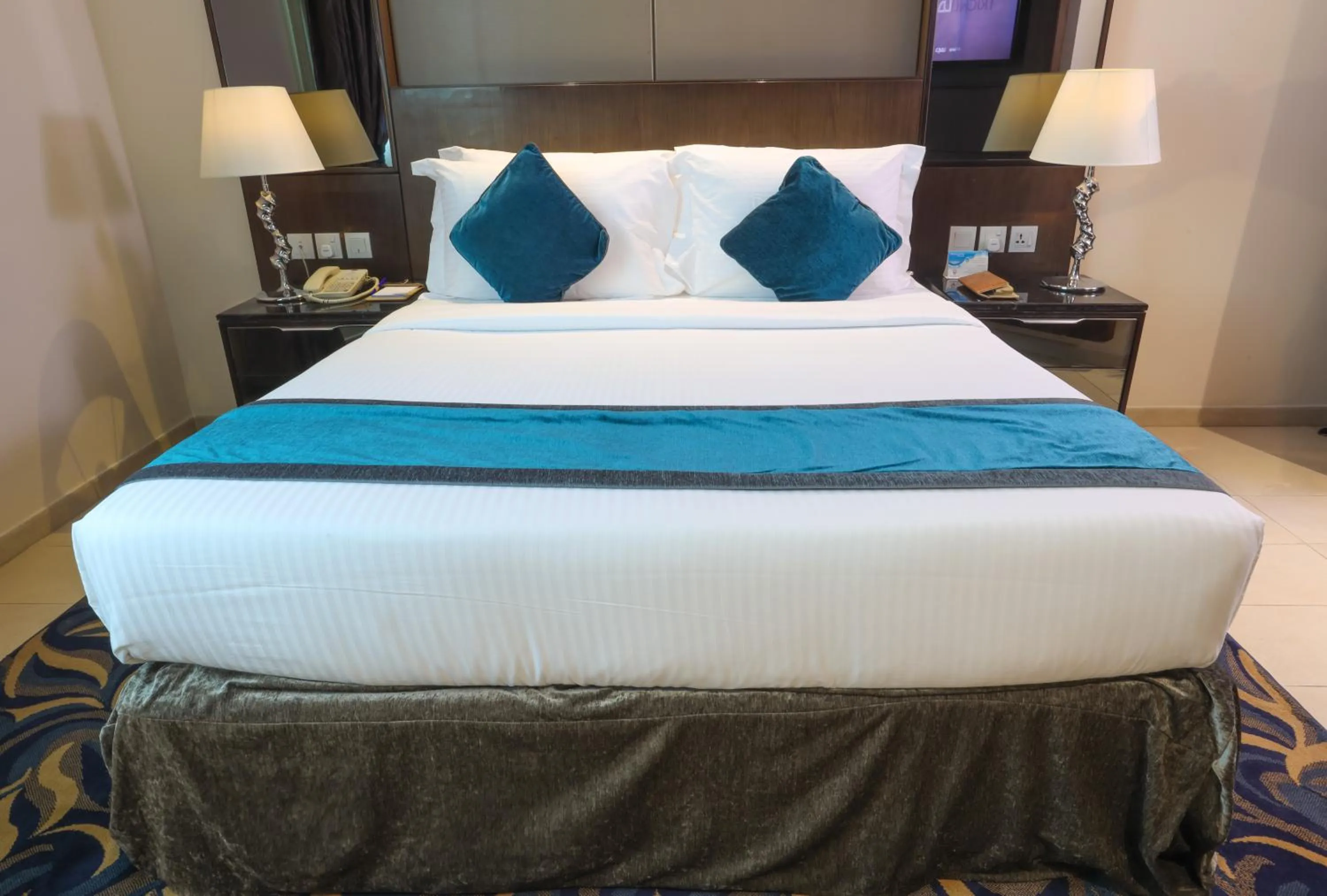 Bed in Omega Hotel Dubai