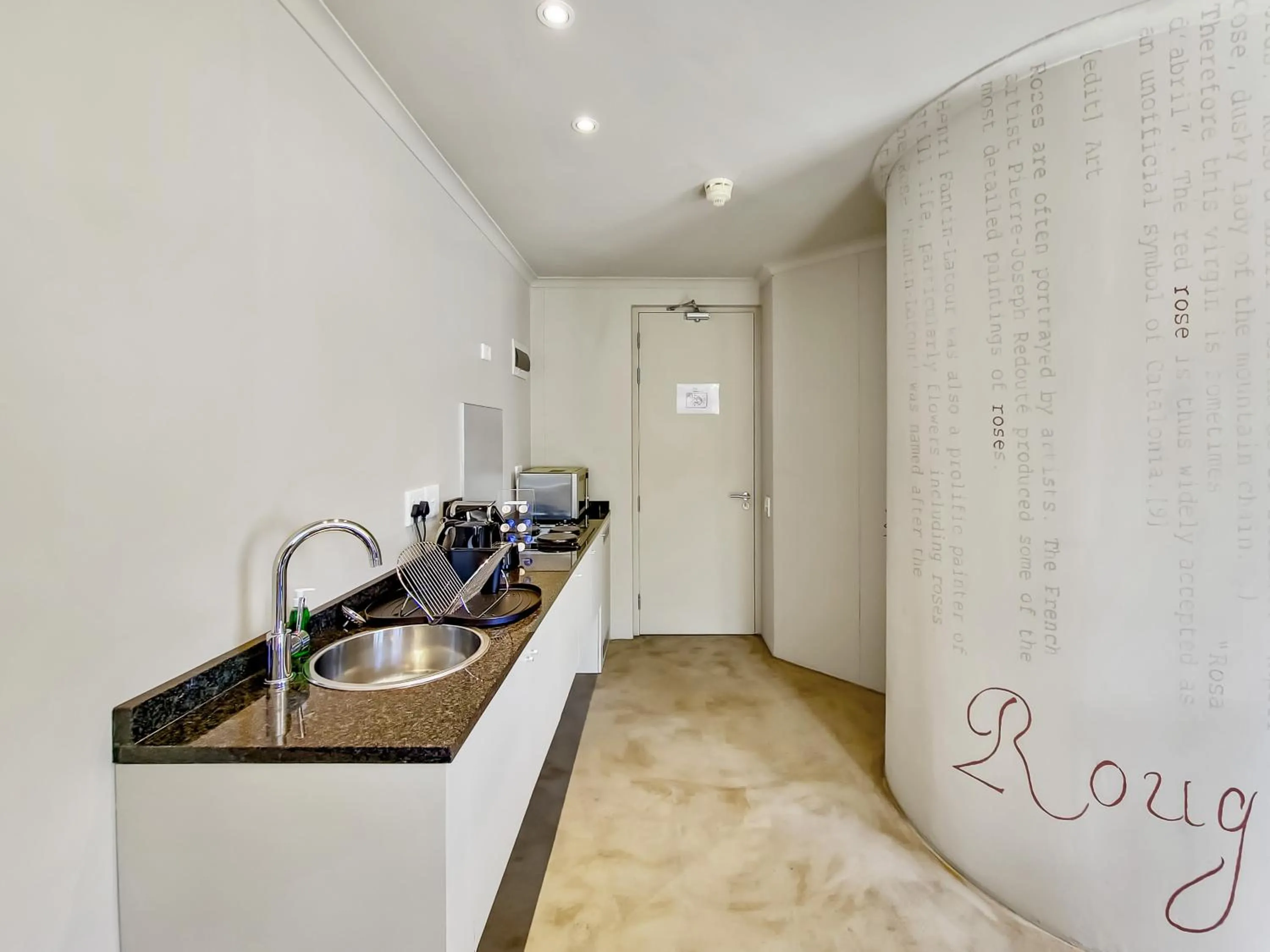 Kitchen or kitchenette in Rouge on Rose Boutique Hotel