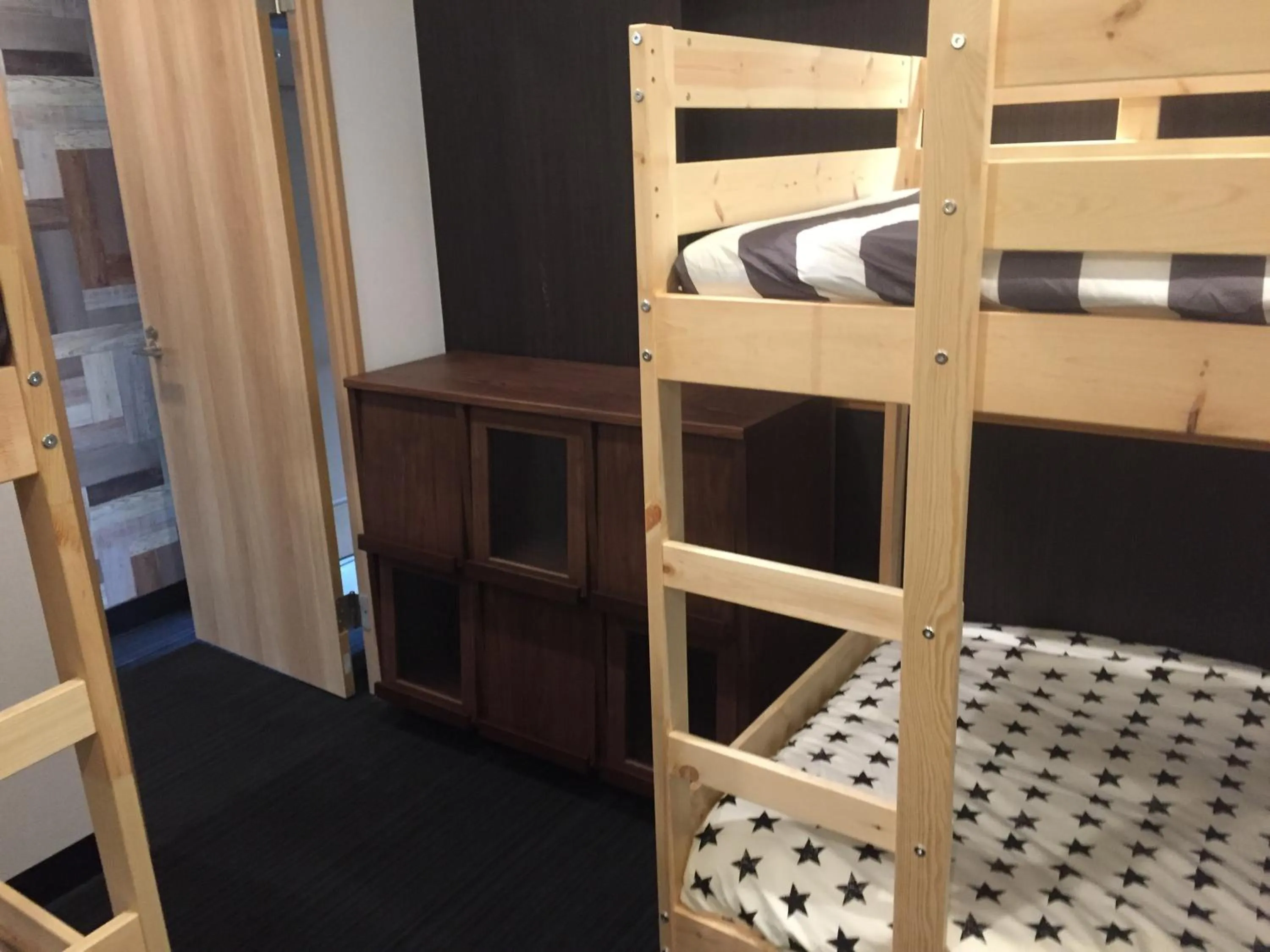 Bed in Guest House Yasuragi Hakataekimae