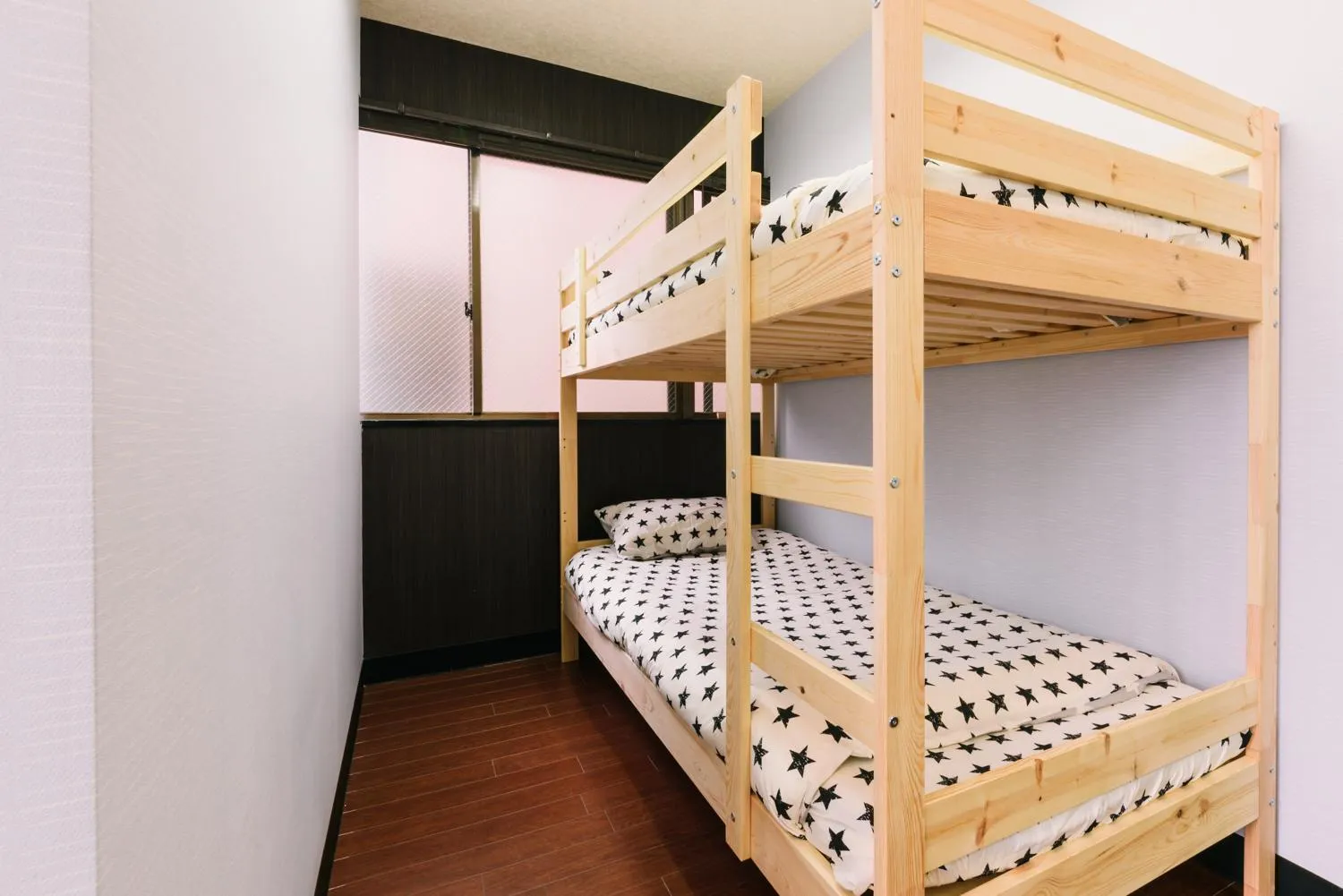 Bed in Guest House Yasuragi Hakataekimae