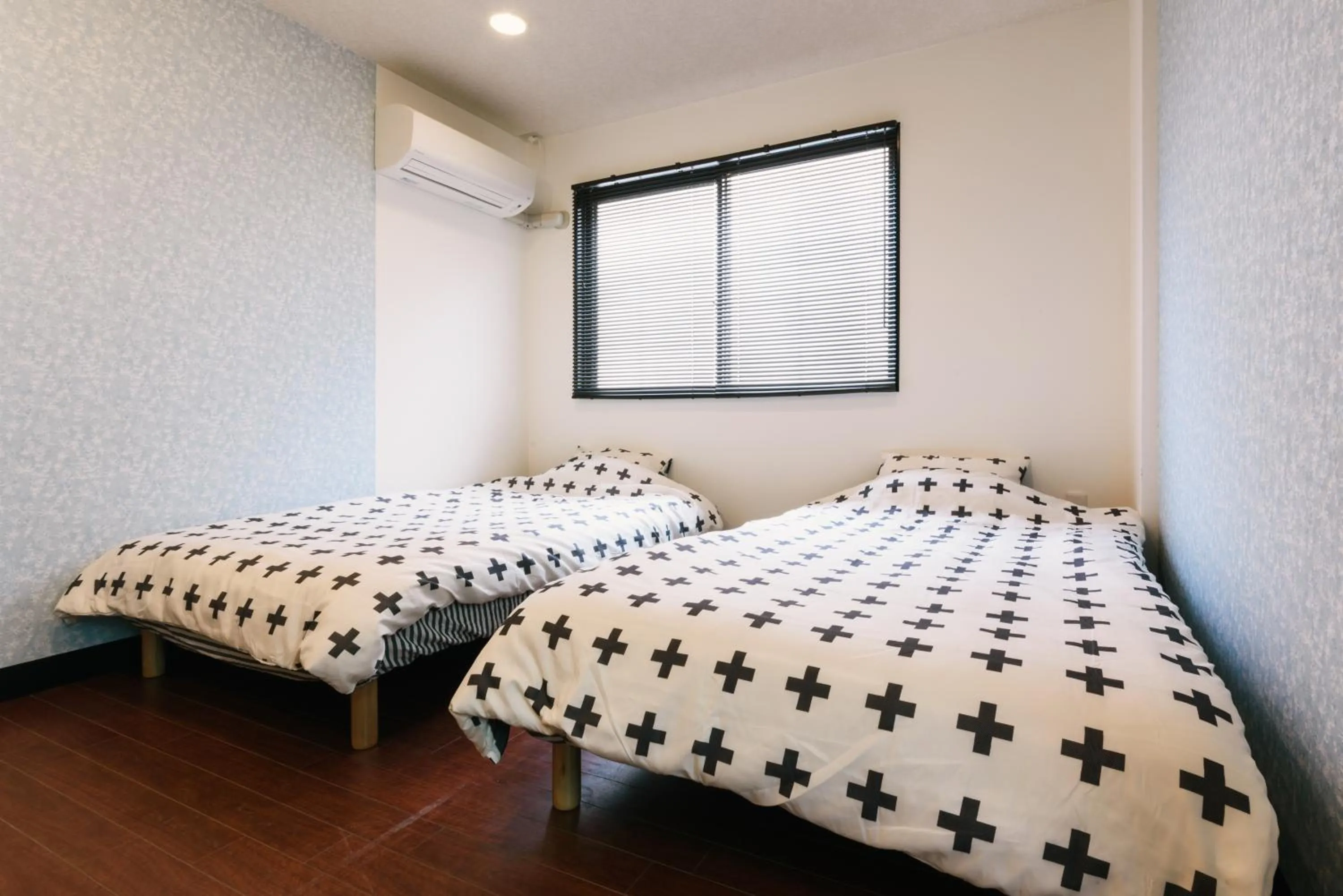 Bed in Guest House Yasuragi Hakataekimae