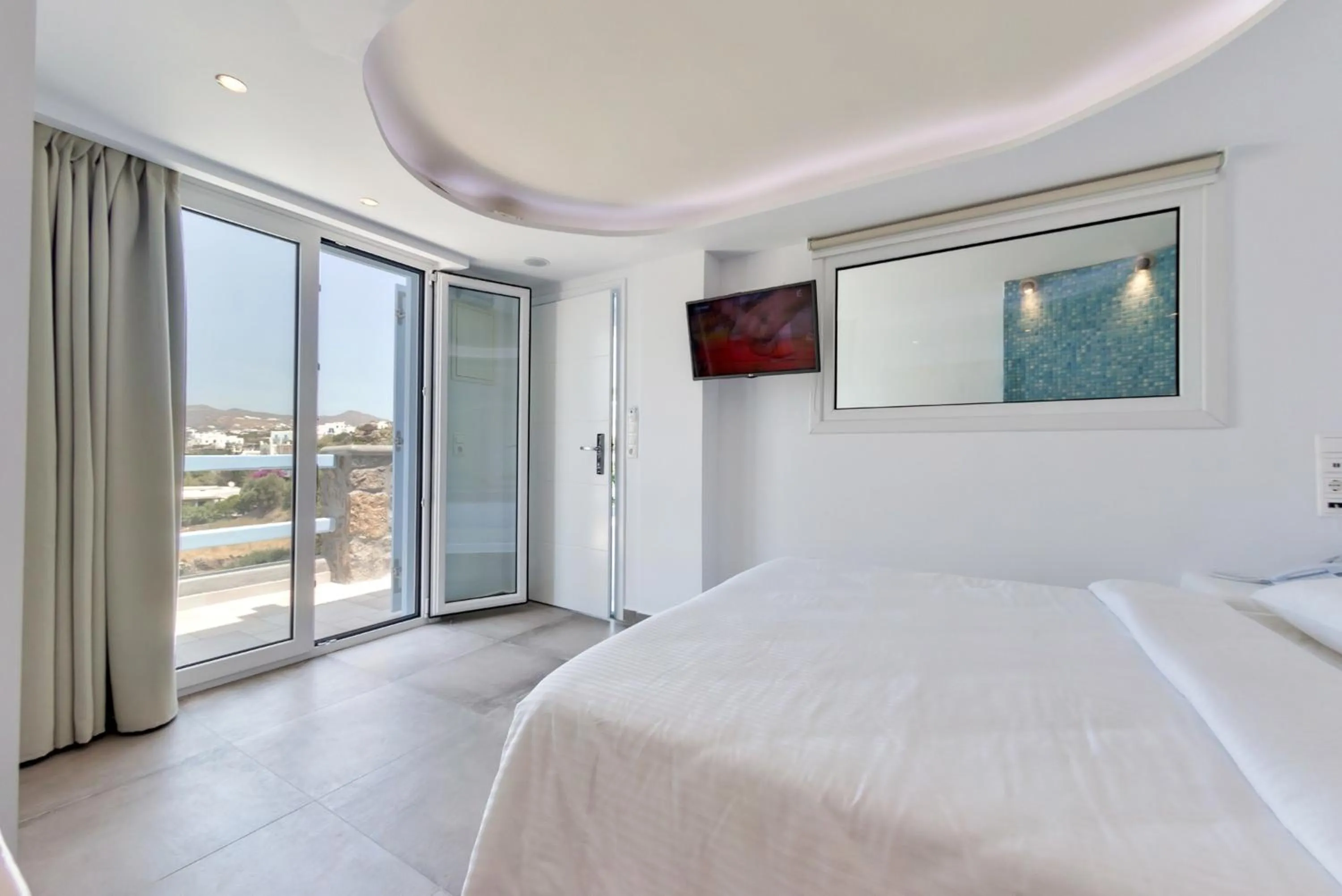 Photo of the whole room, Bed in Ibiscus Boutique