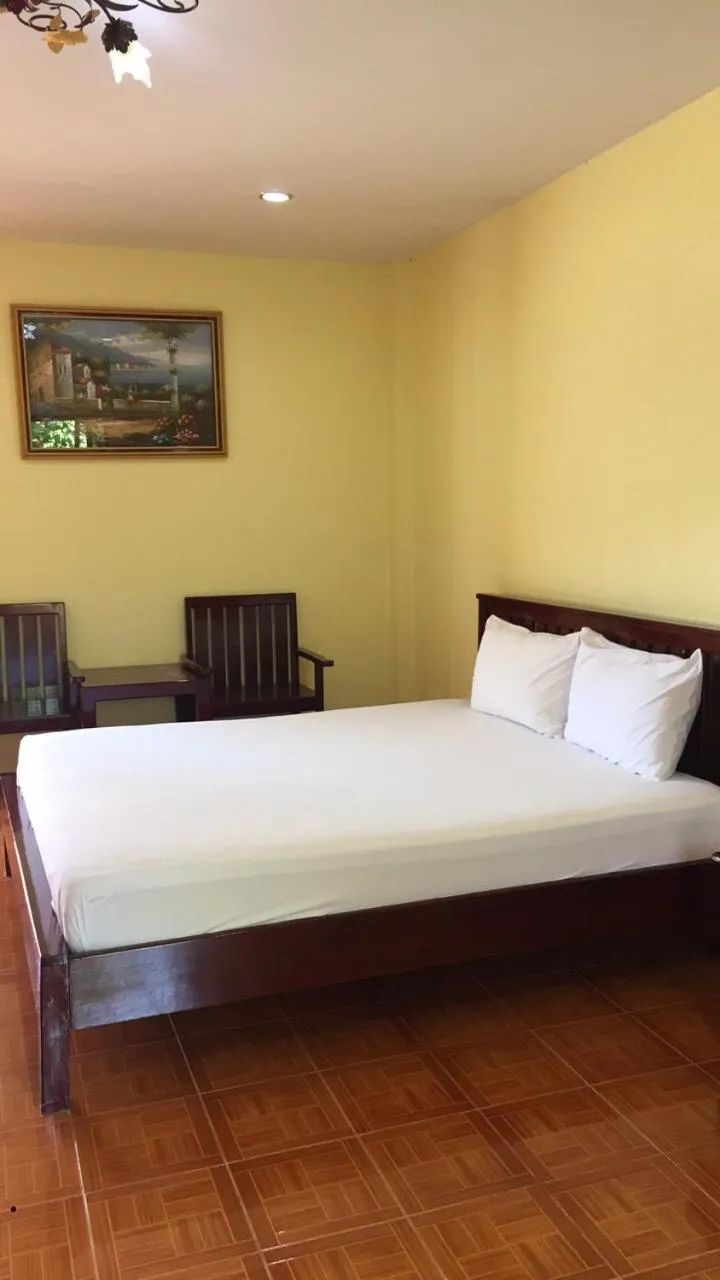 Bed in Poon Suk Hotel Kabin Buri