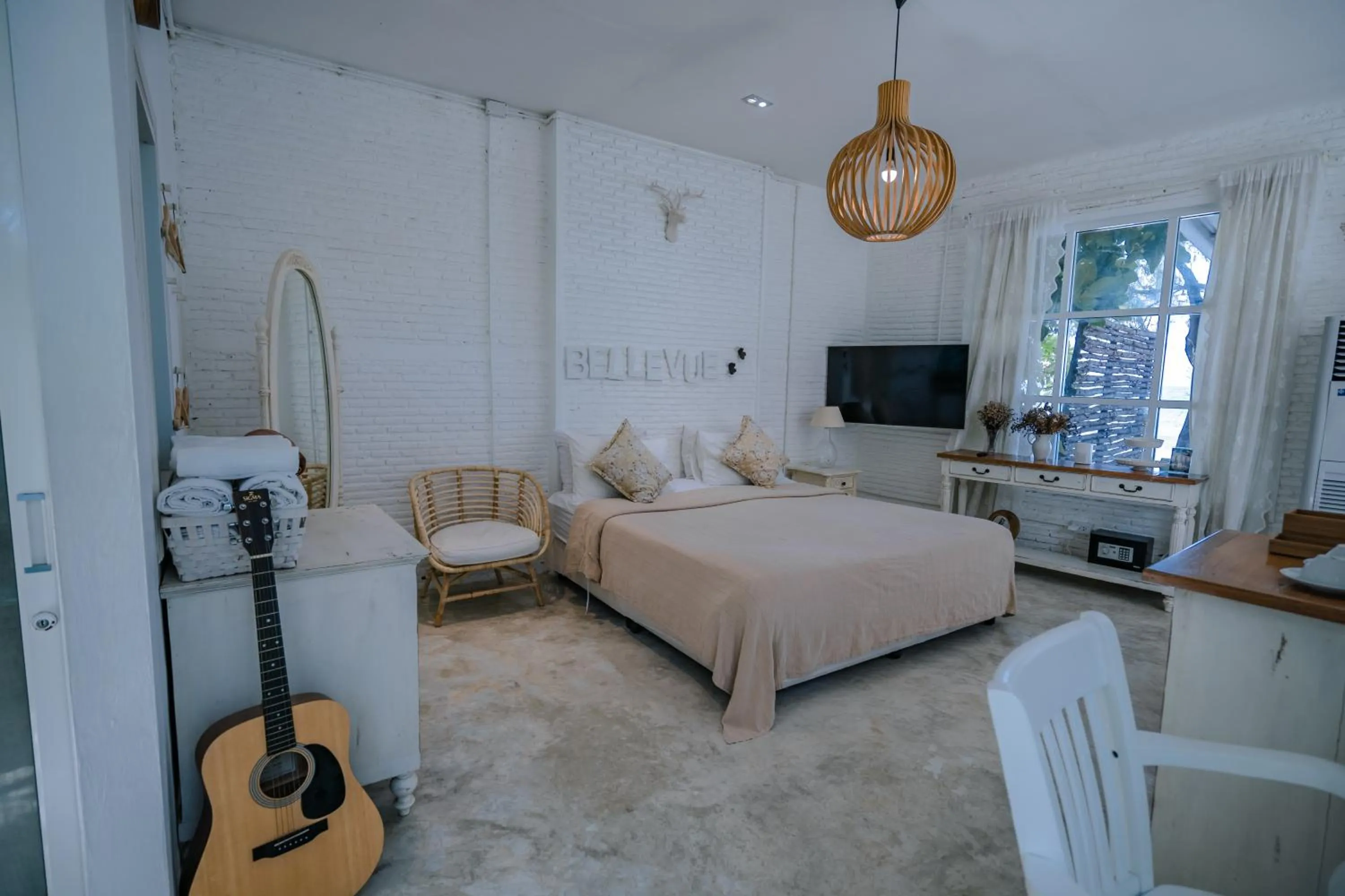 Bed in Green Gallery Beach Boutique Hotel