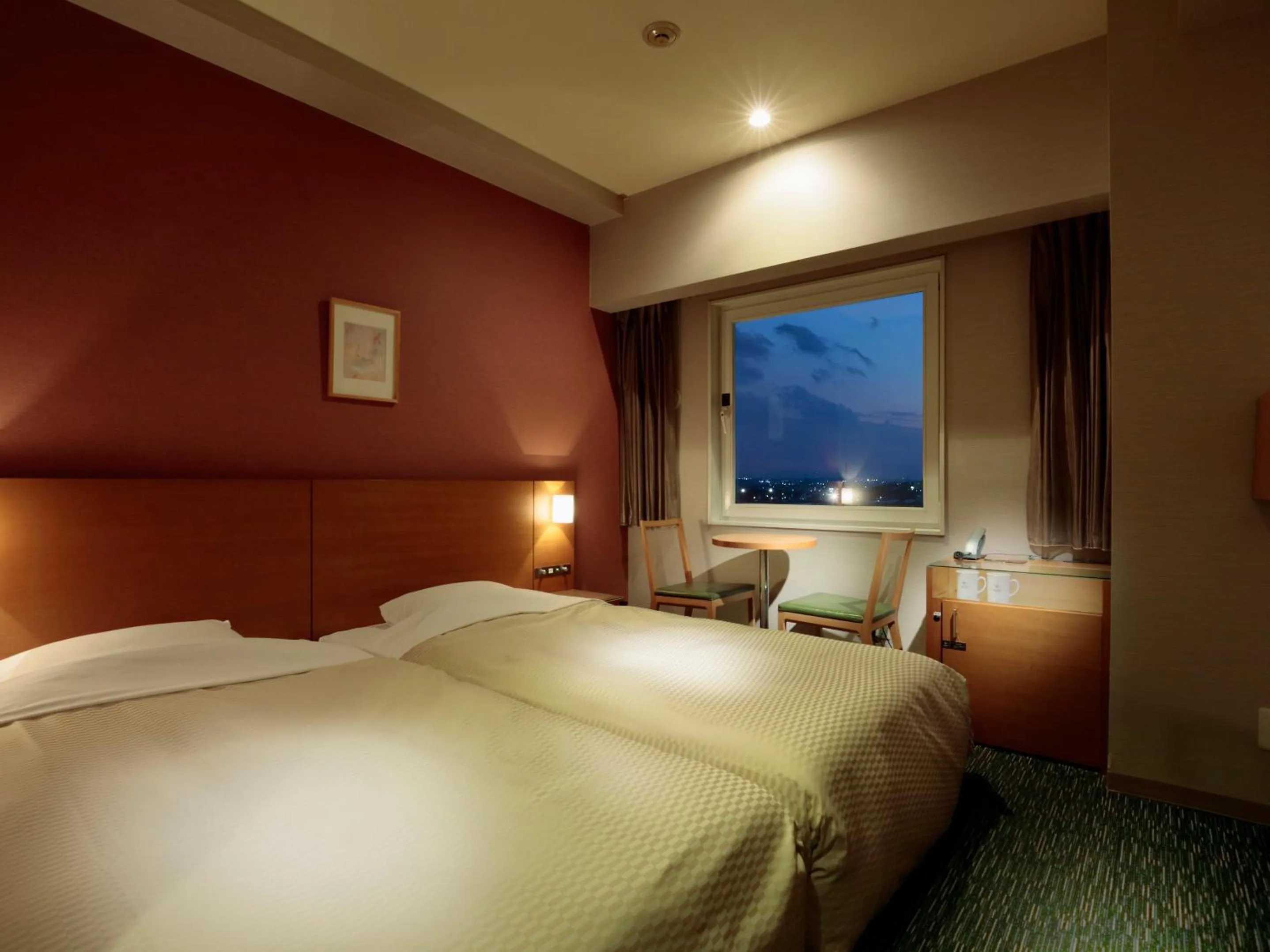 Bed in Candeo Hotels Sano