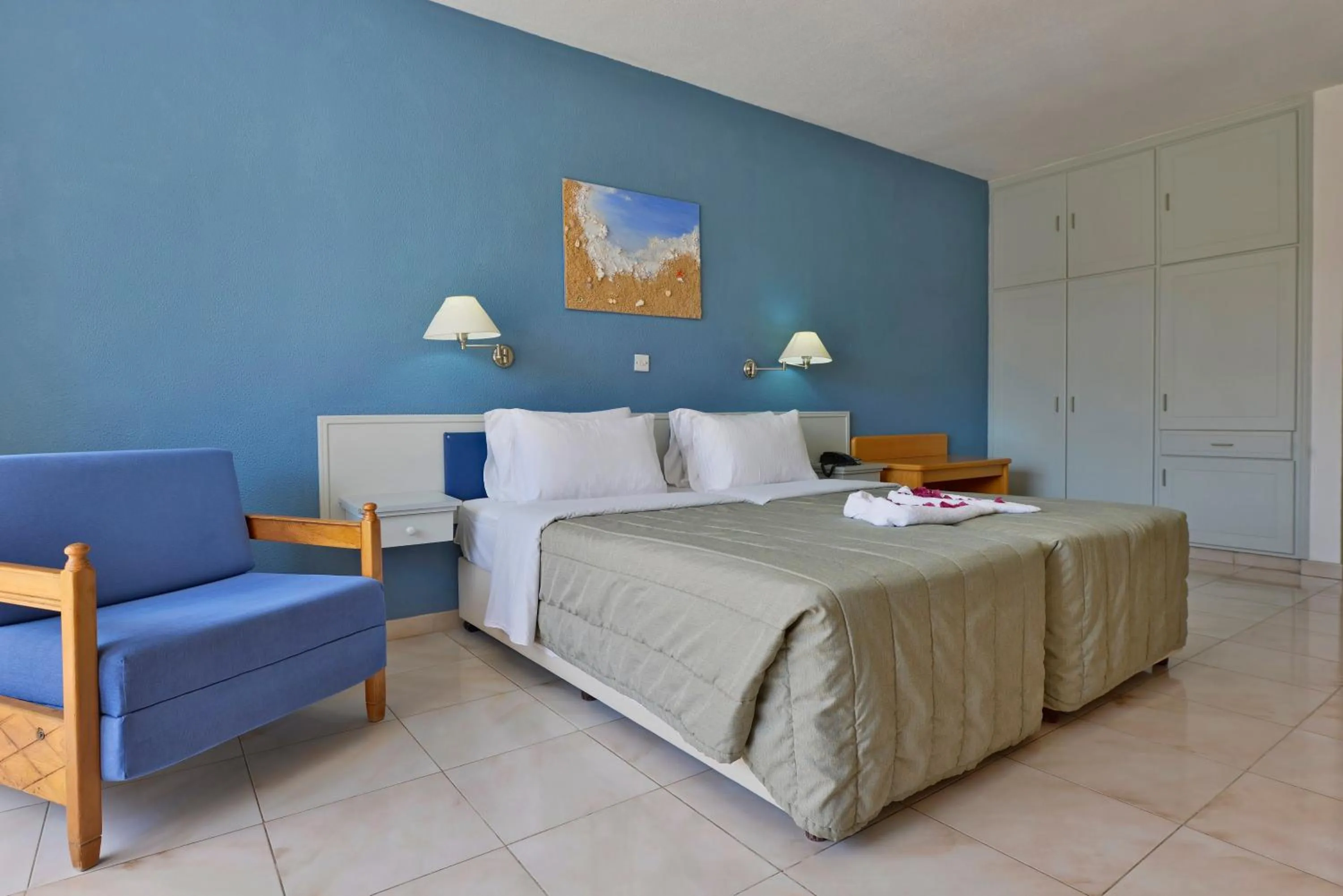 Seating area, Bed in Napa Prince Hotel Apts