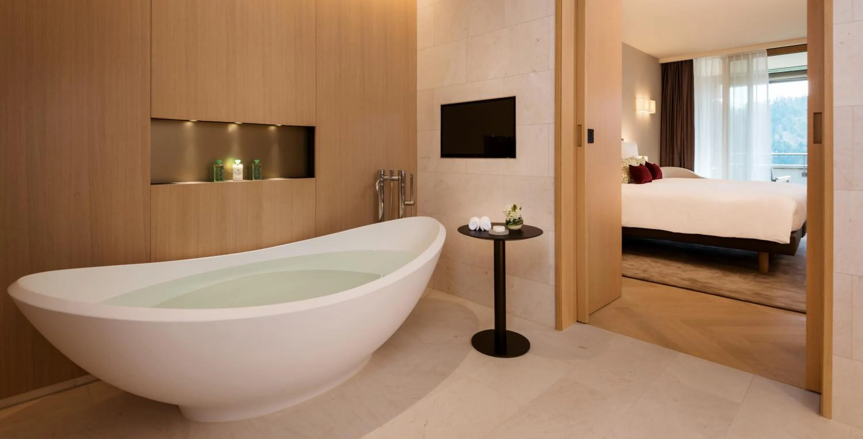 Bathroom, Bed in Waldhotel by Bürgenstock