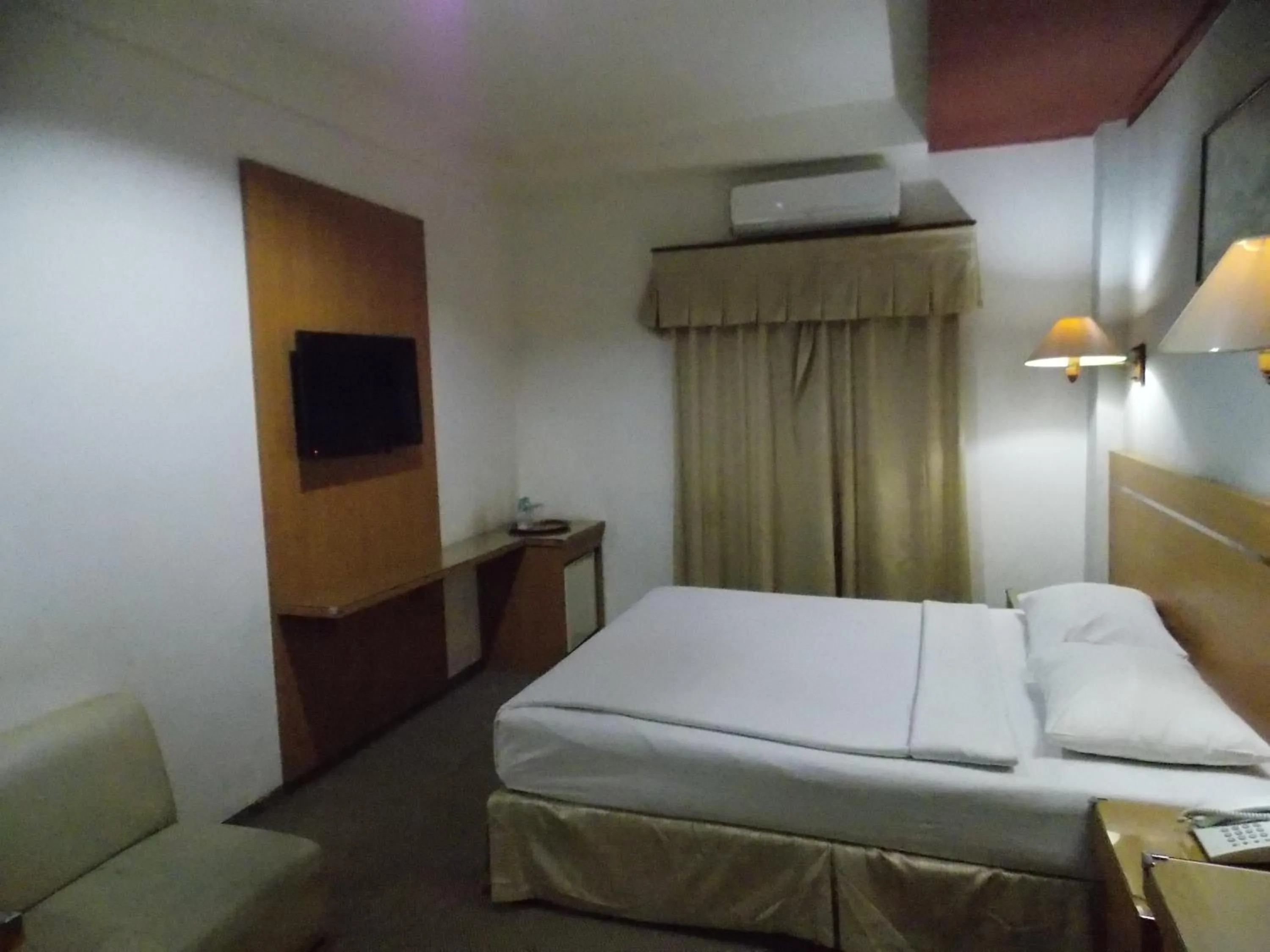 Bed in Puri Mega Hotel