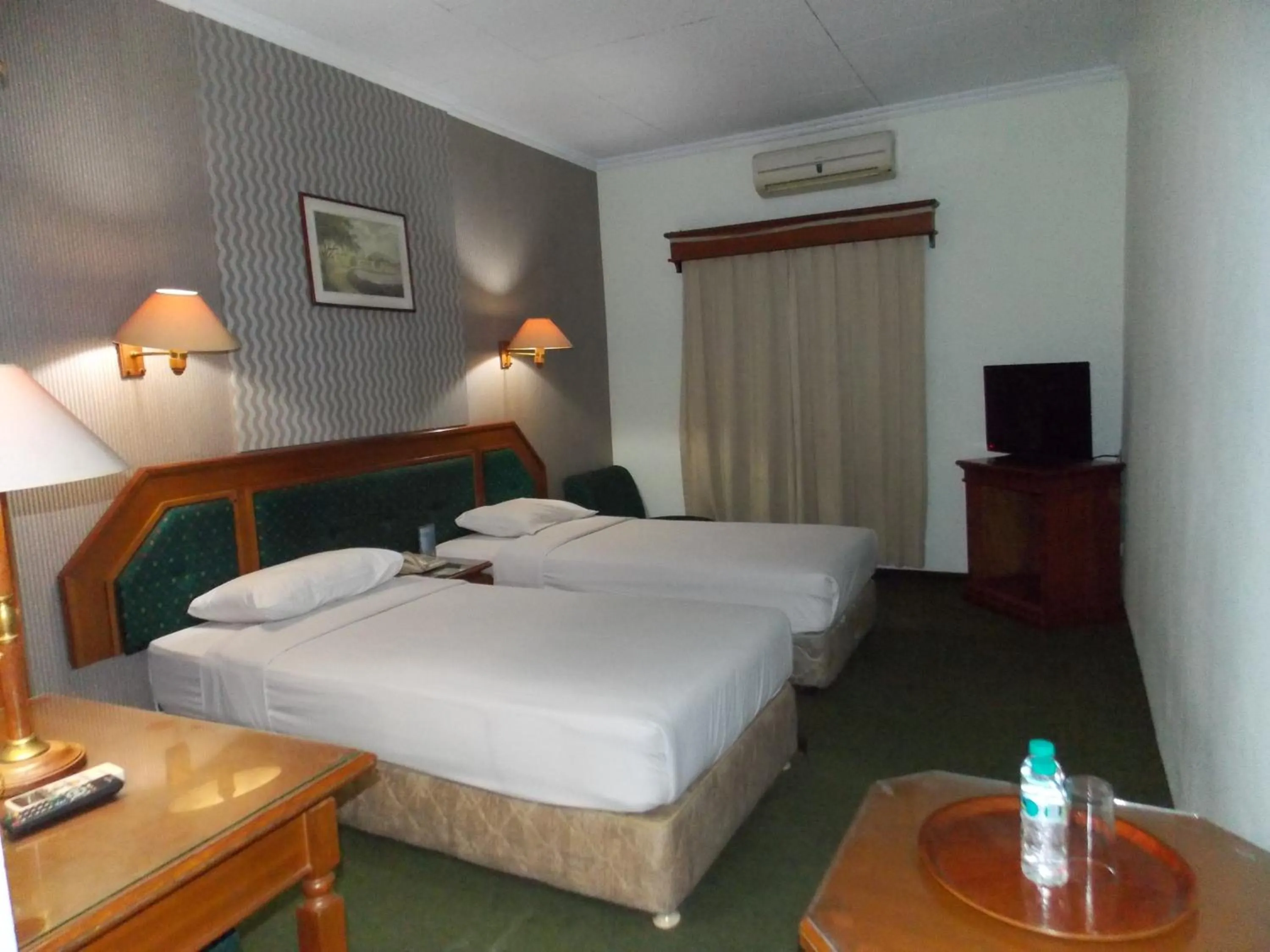 Bed in Puri Mega Hotel