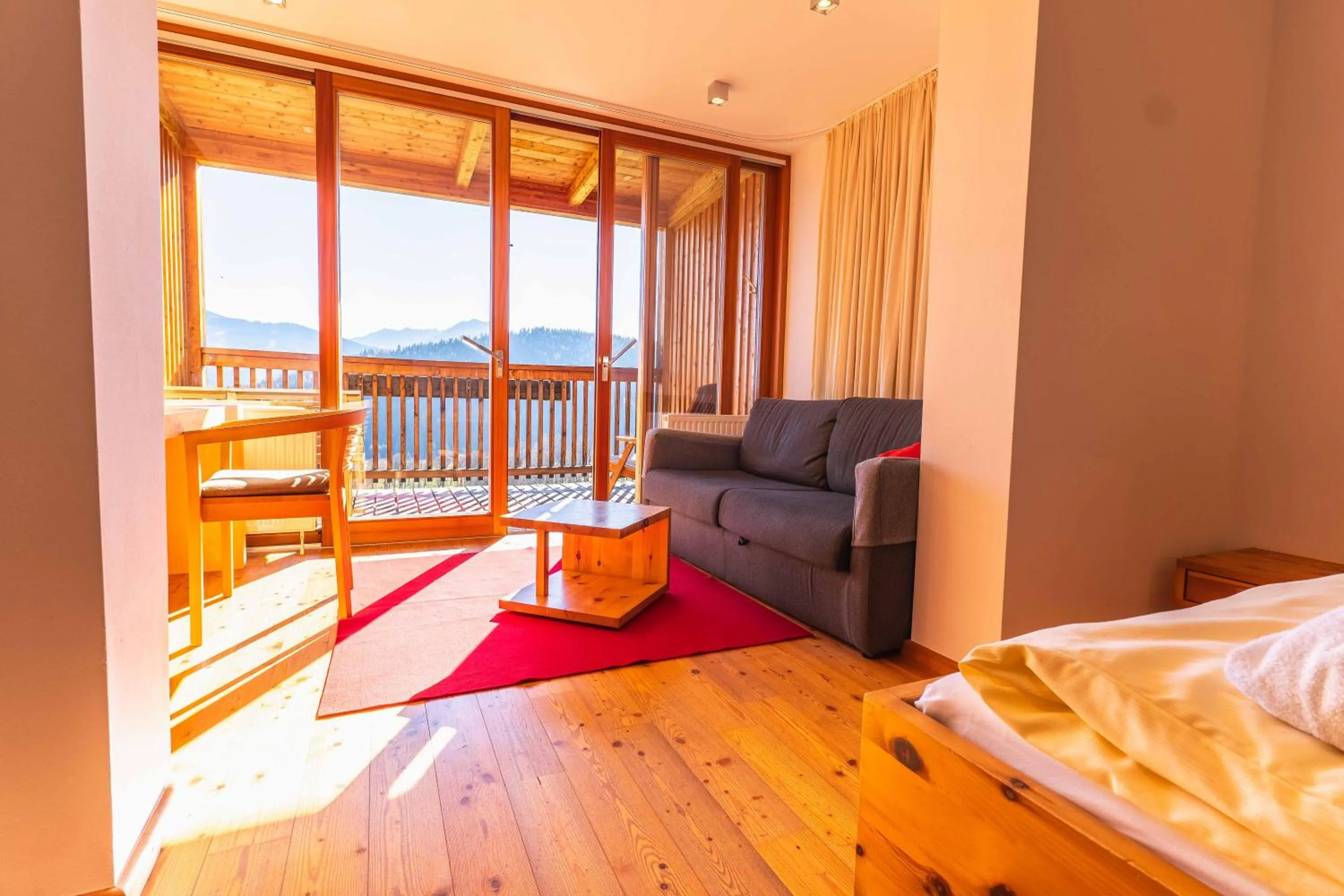 Living room, Bed in Hotel Ramsauhof Pool & Wellness Breakfast & Light Dinner Buffet