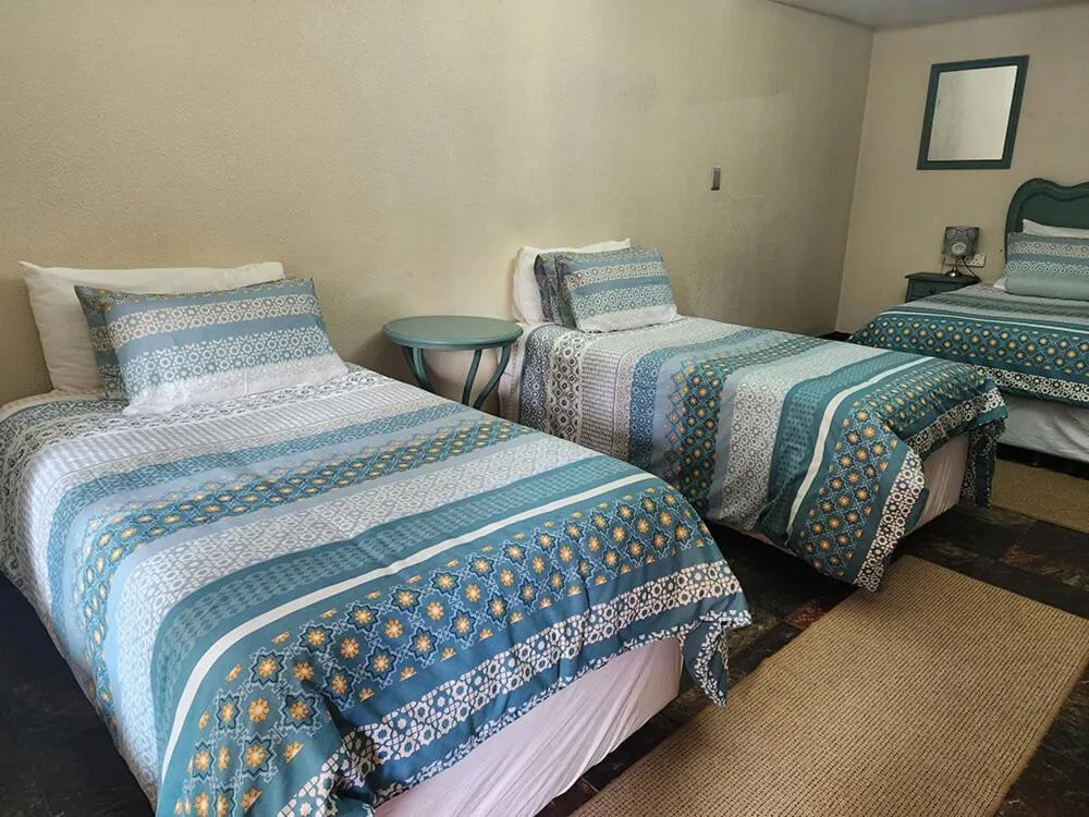 Bed in Goodnight Guest Lodge