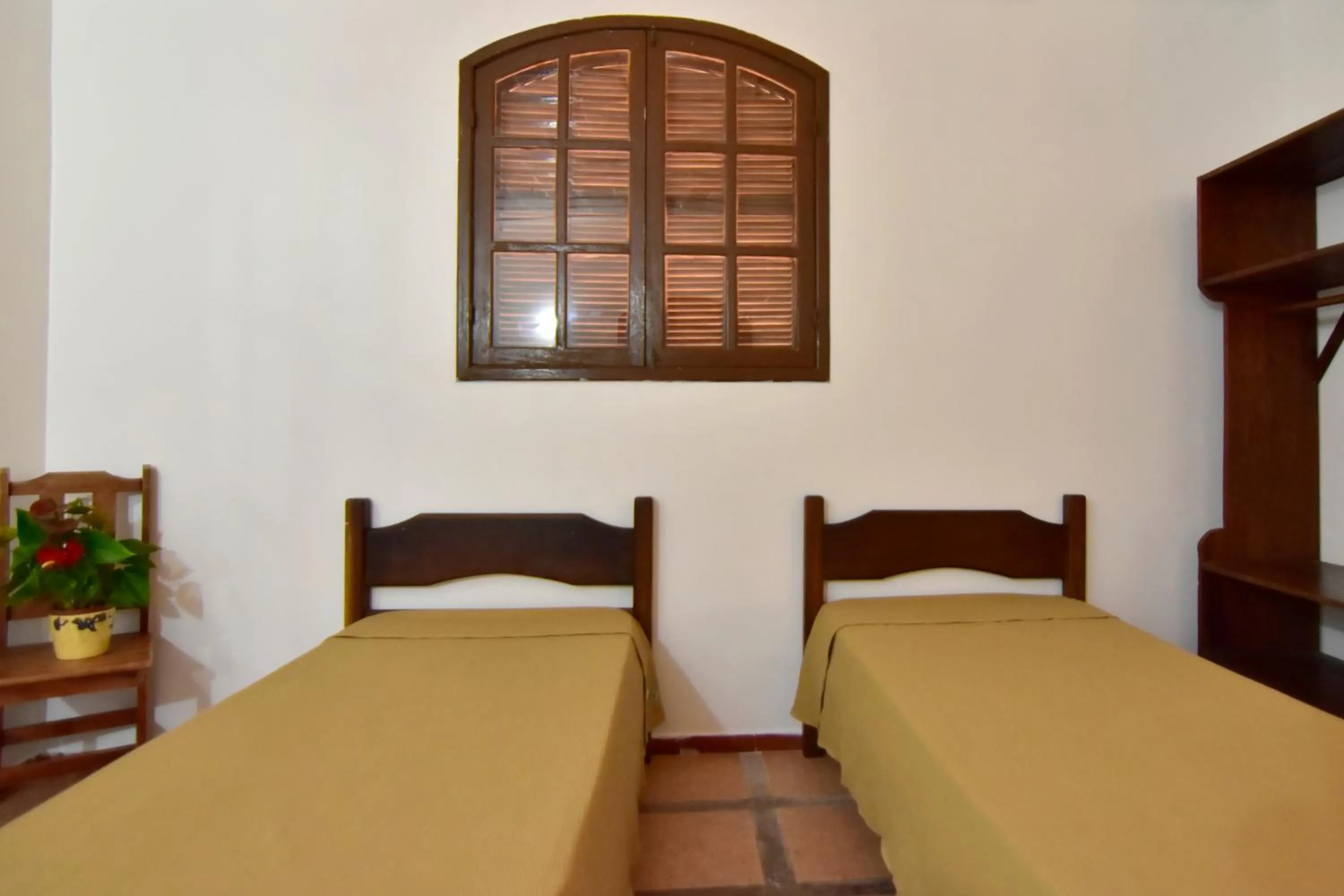 Bed in Pousada Tanto Mar