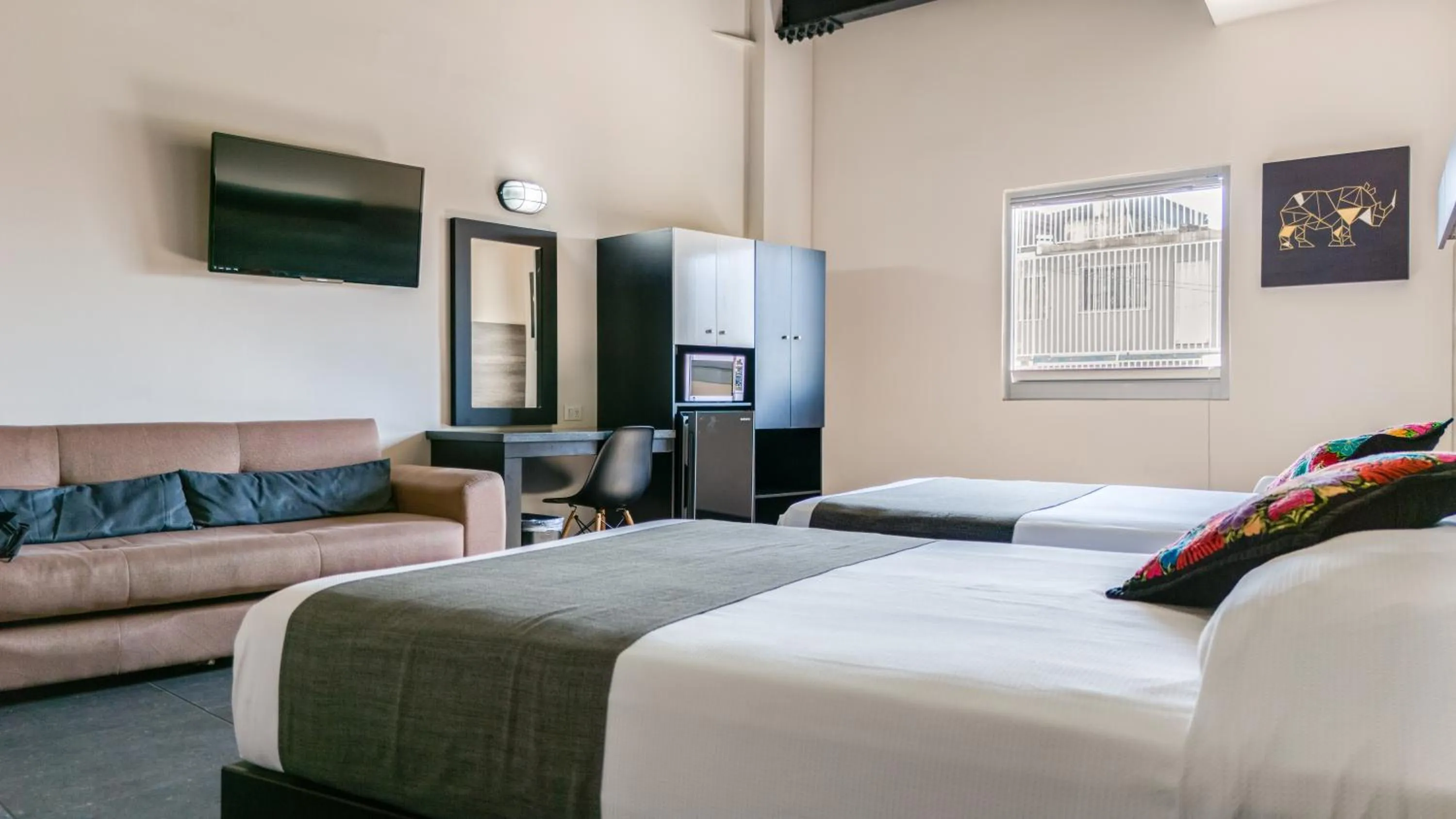 Bed in Homesuites Malecon