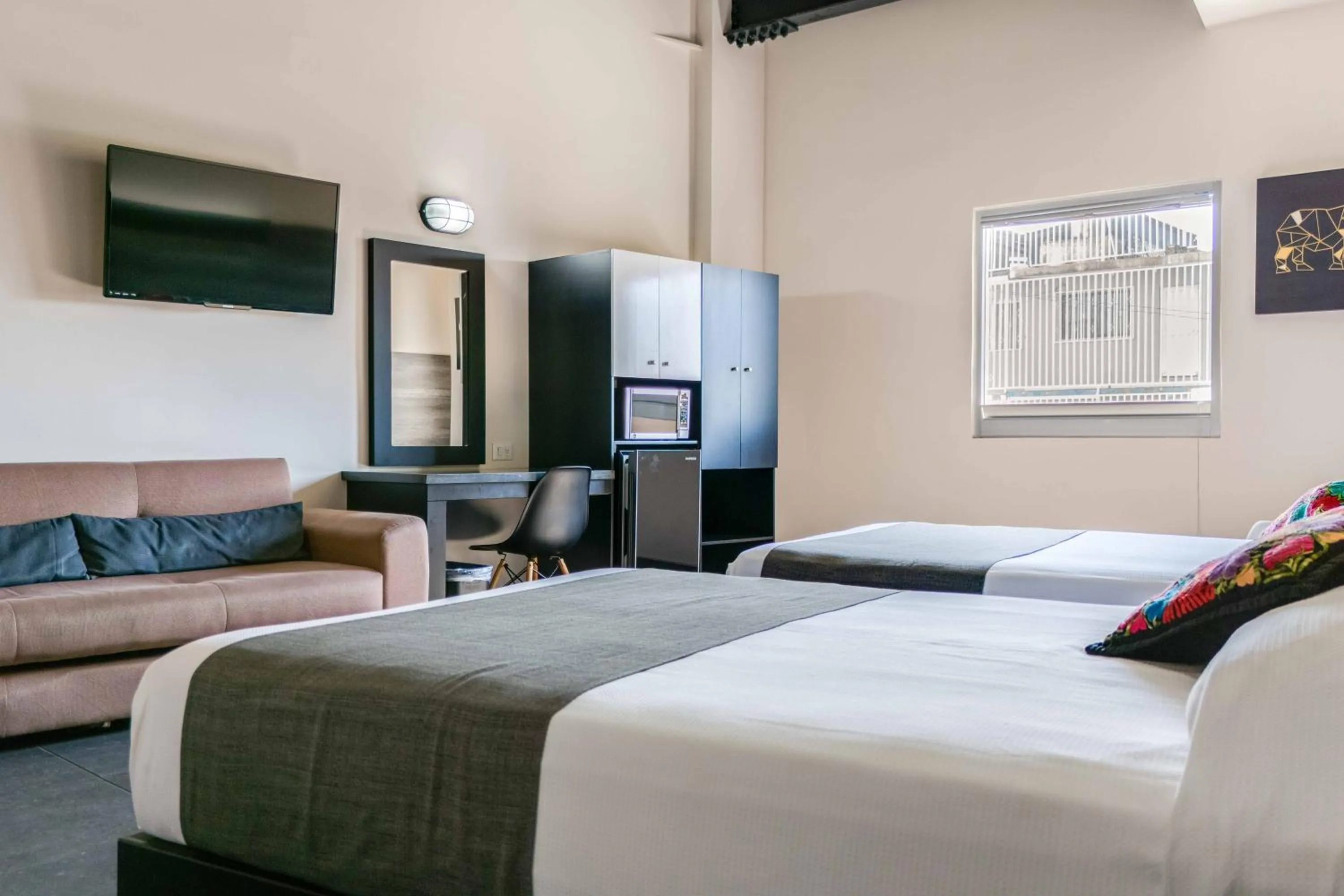 Bed in Homesuites Malecon