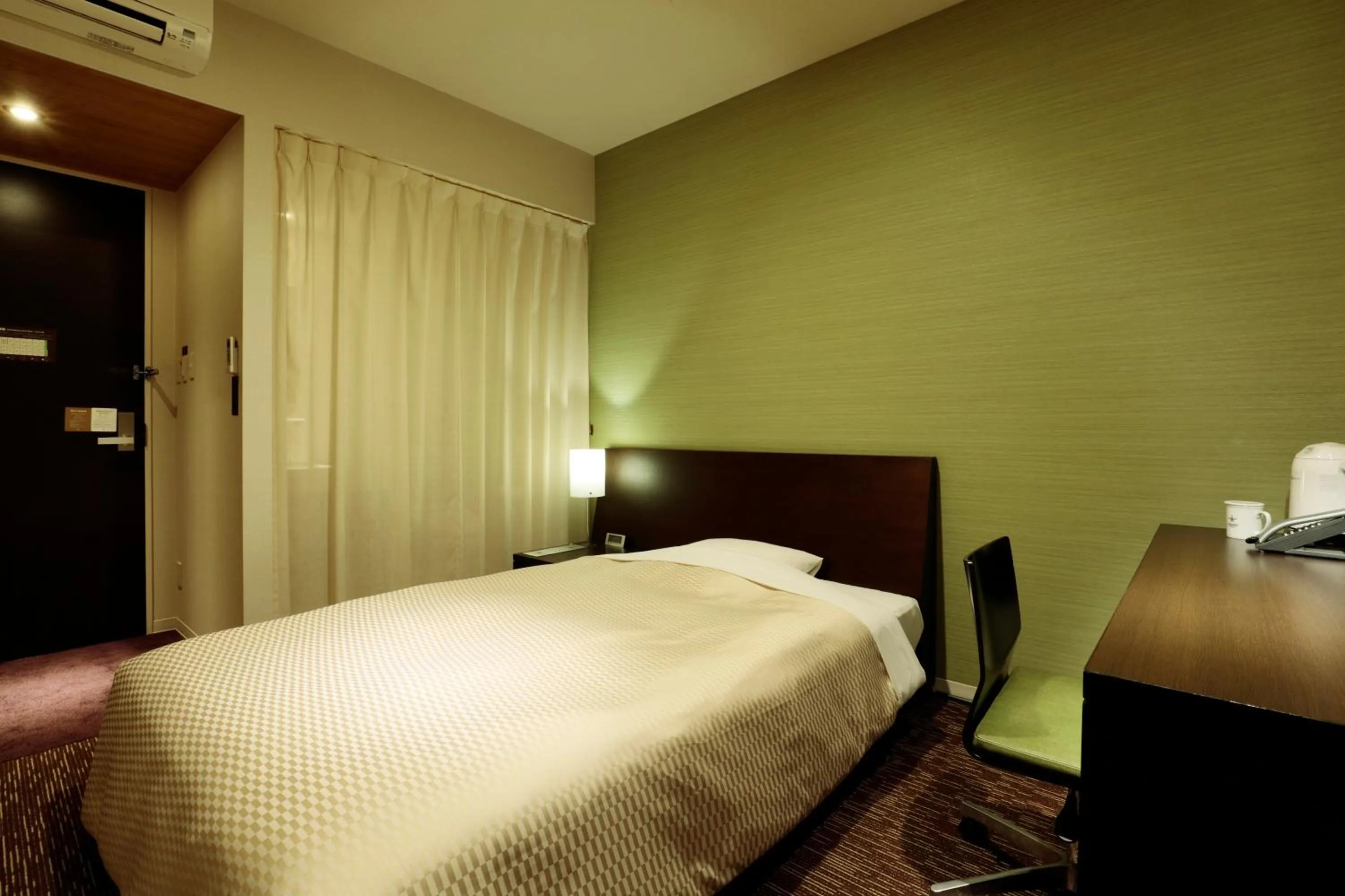 Bed in Candeo Hotels Shizuoka Shimada