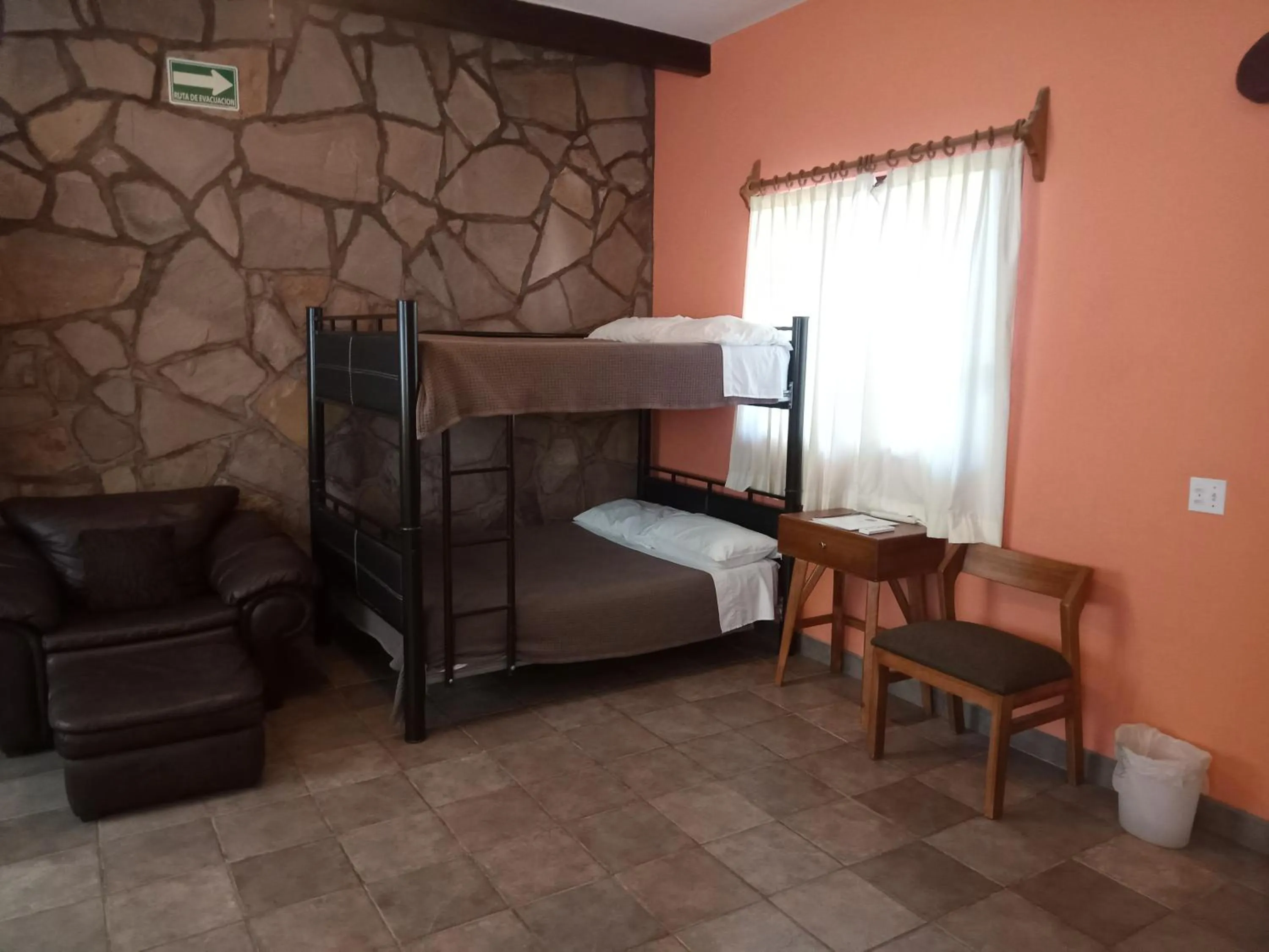 Seating area, Bed in Hacienda De Palmas