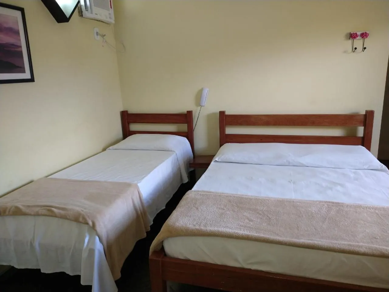 Bed in Pousada Genesis