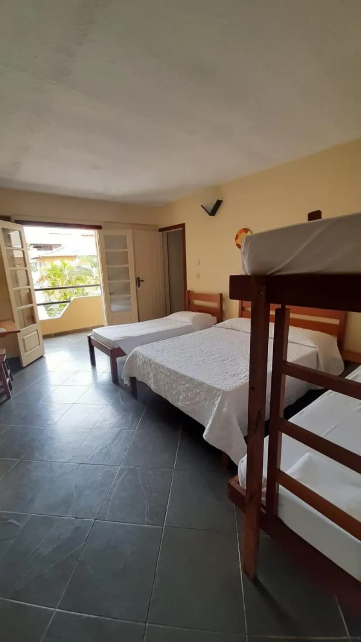 Bed in Pousada Genesis