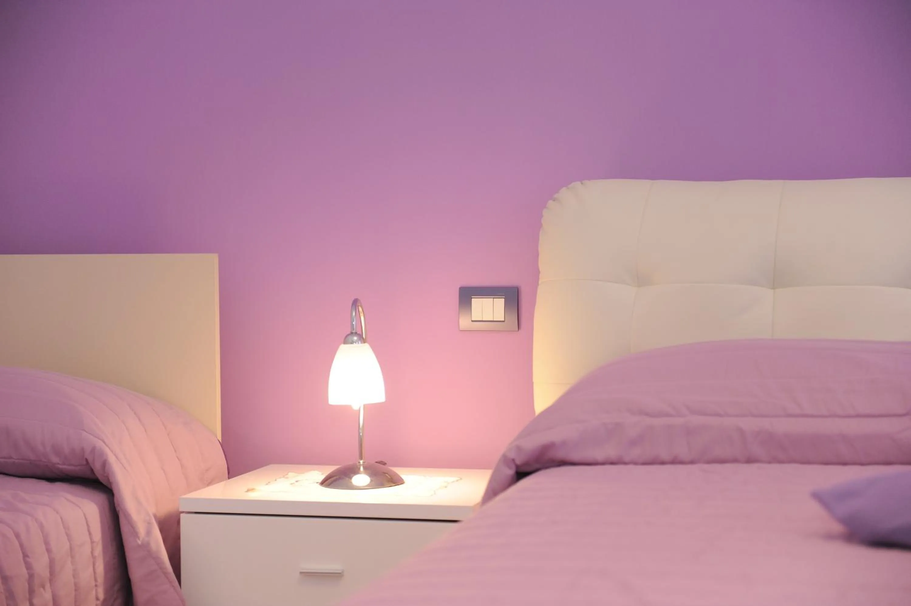 Bed in L'Isola Del Postino Rooms