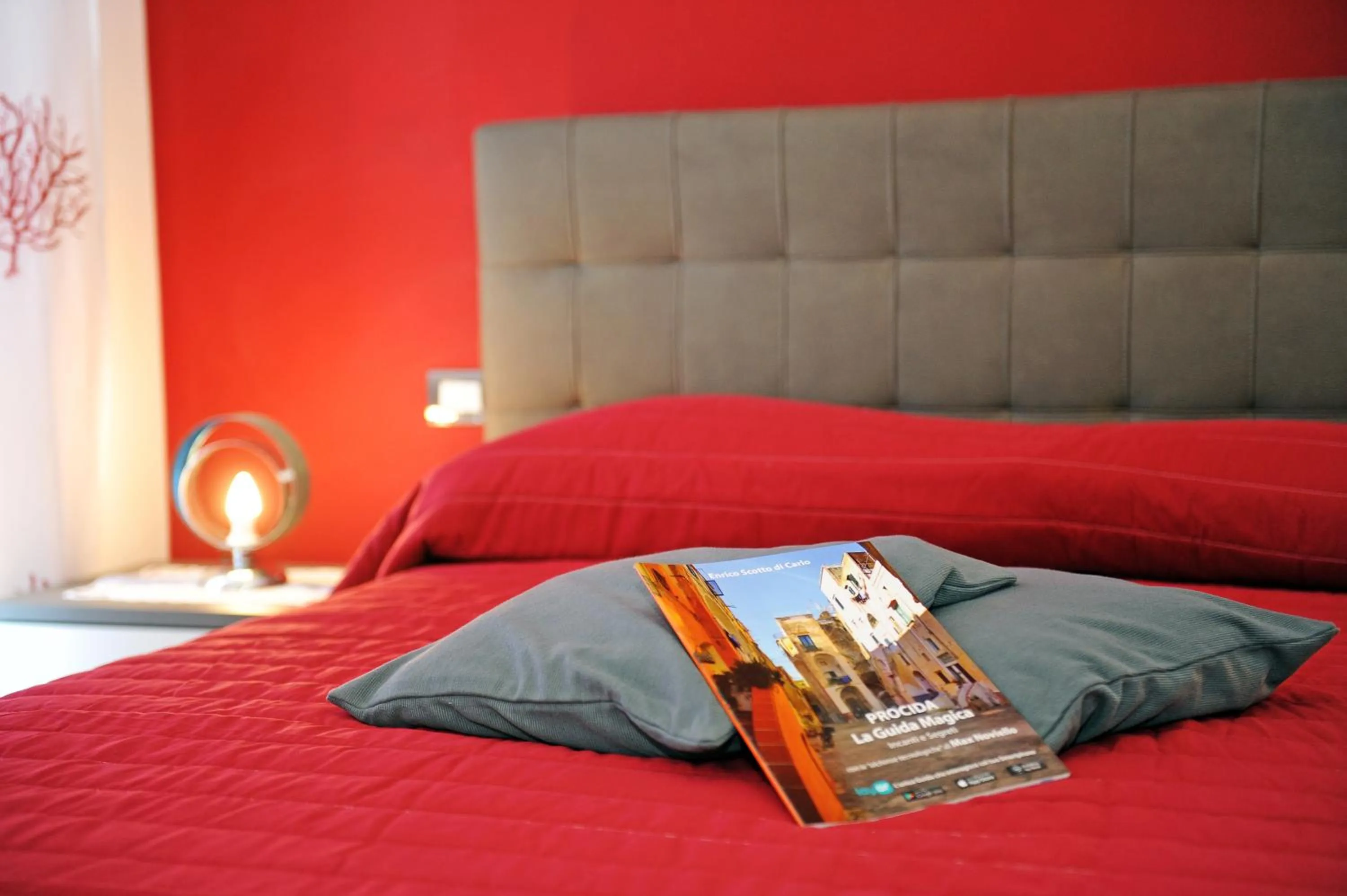 Bed in L'Isola Del Postino Rooms