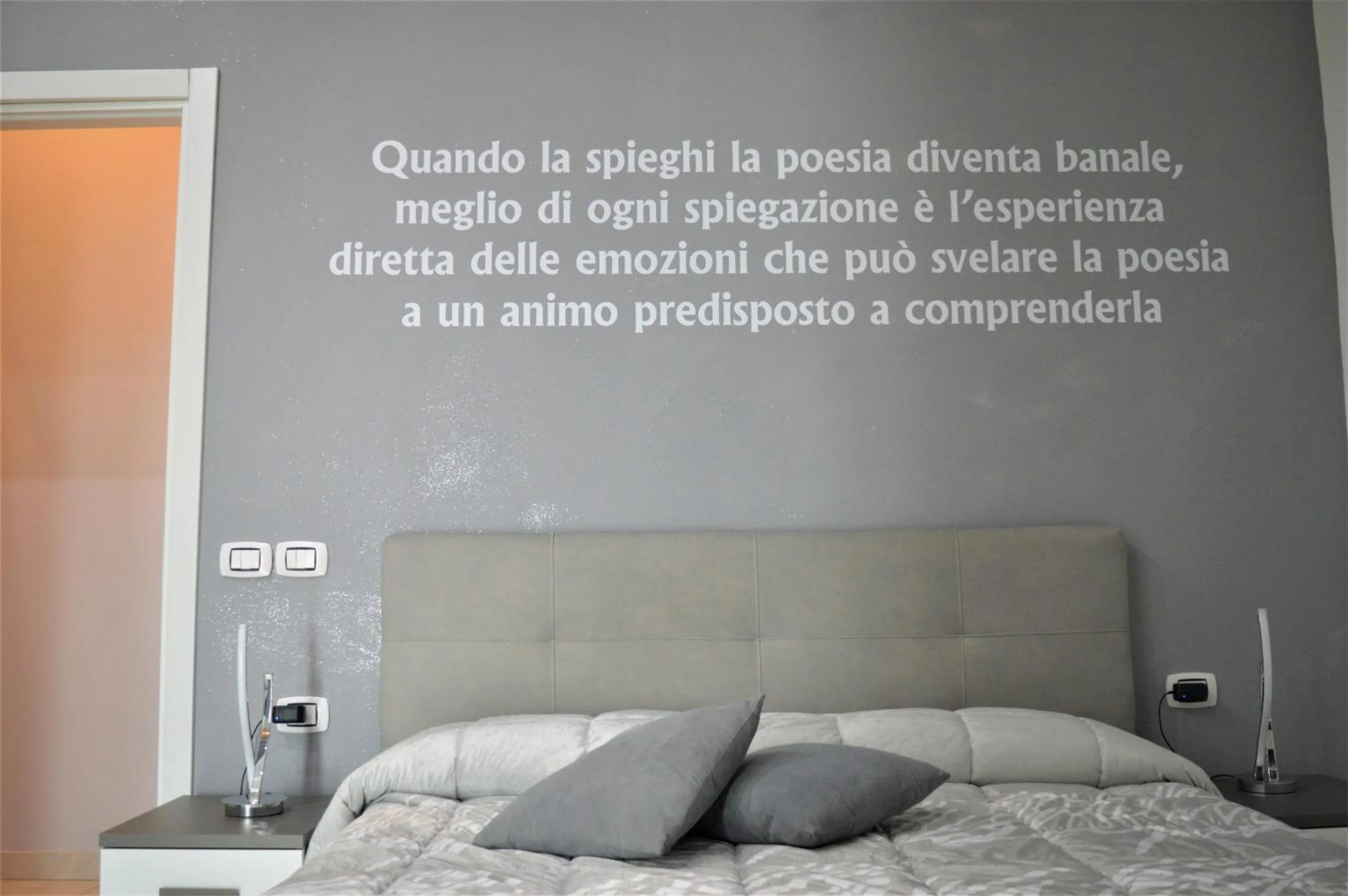 Bed in L'Isola Del Postino Rooms