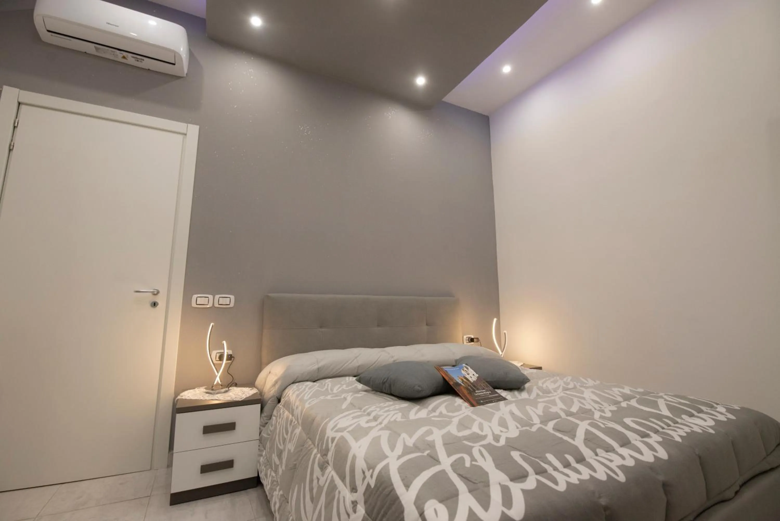 Bed in L'Isola Del Postino Rooms