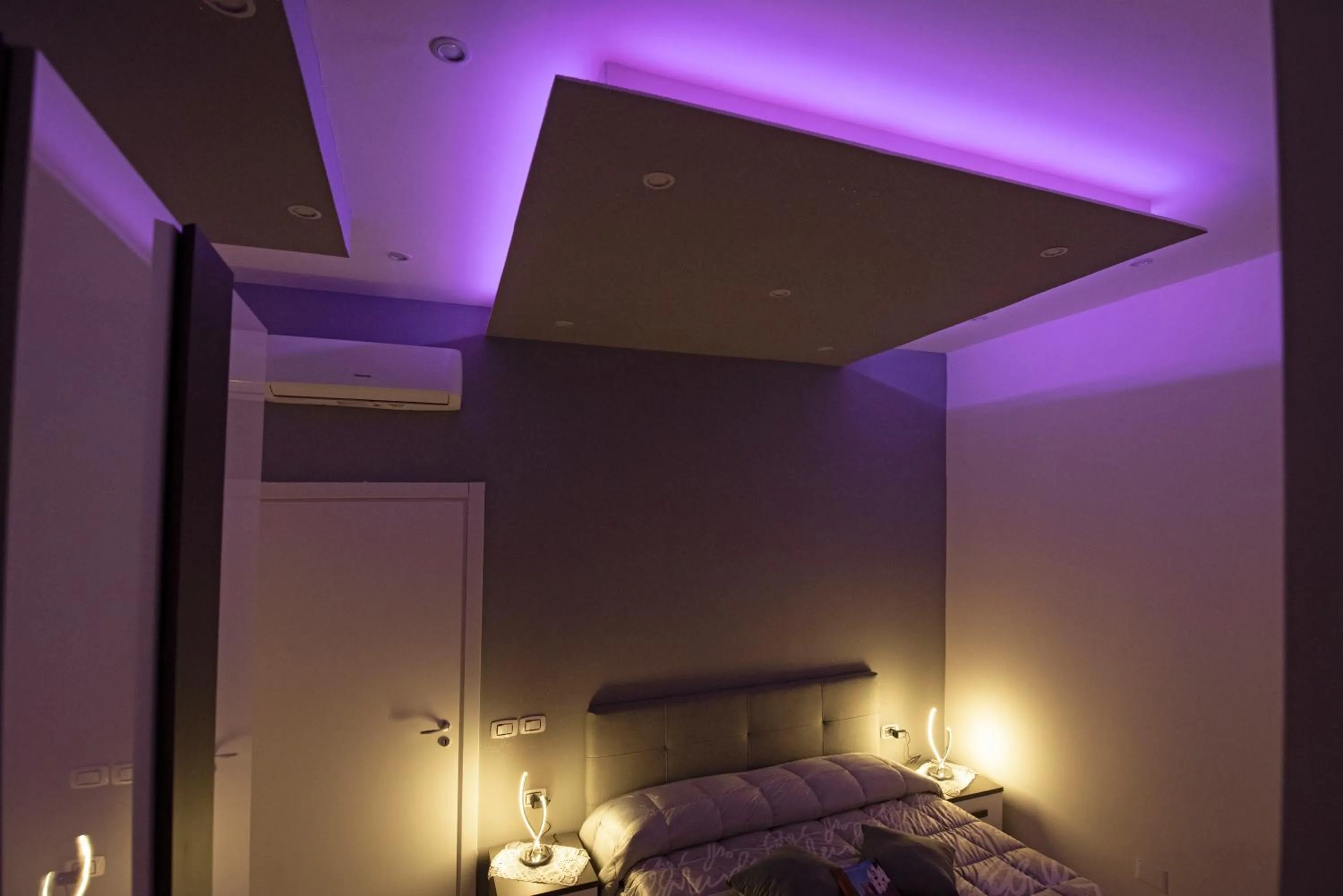 Bed in L'Isola Del Postino Rooms