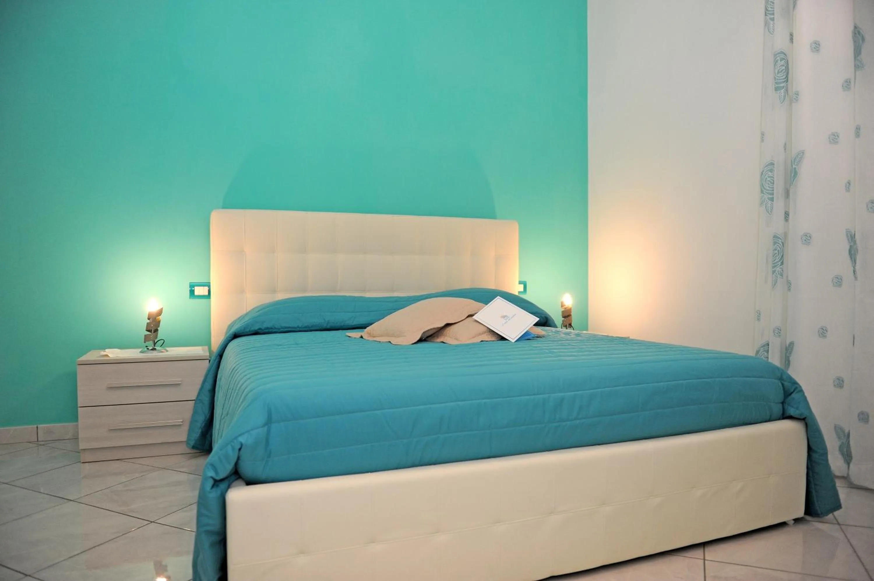 Bed in L'Isola Del Postino Rooms