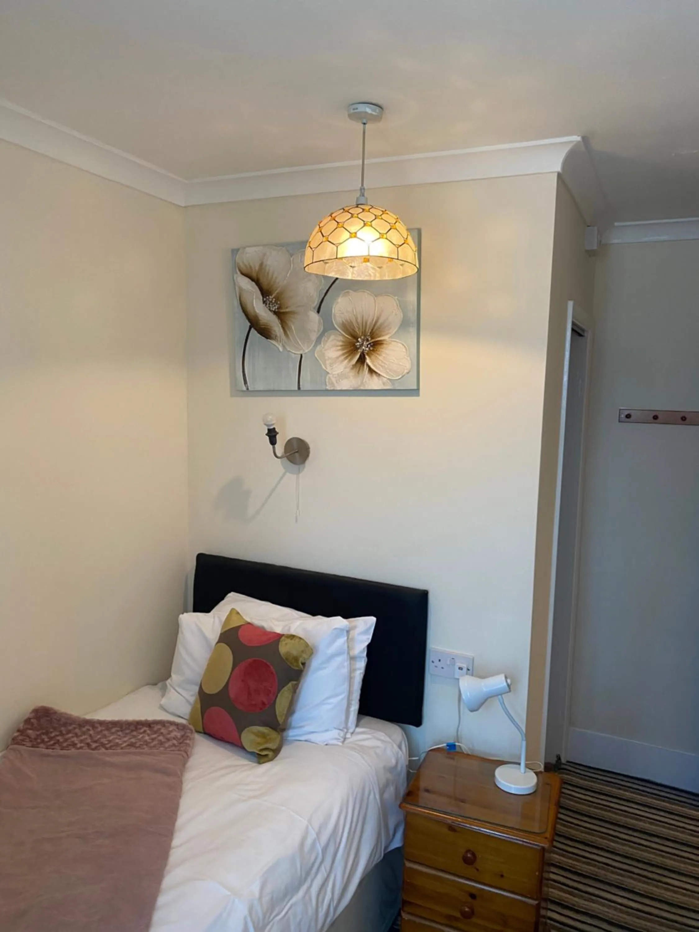 Bed in Four Seasons Guest House