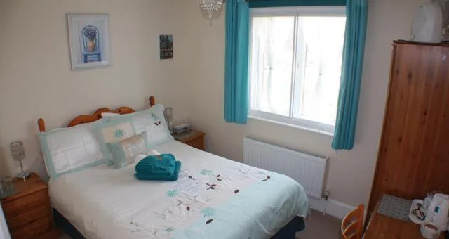 Bed in Four Seasons Guest House