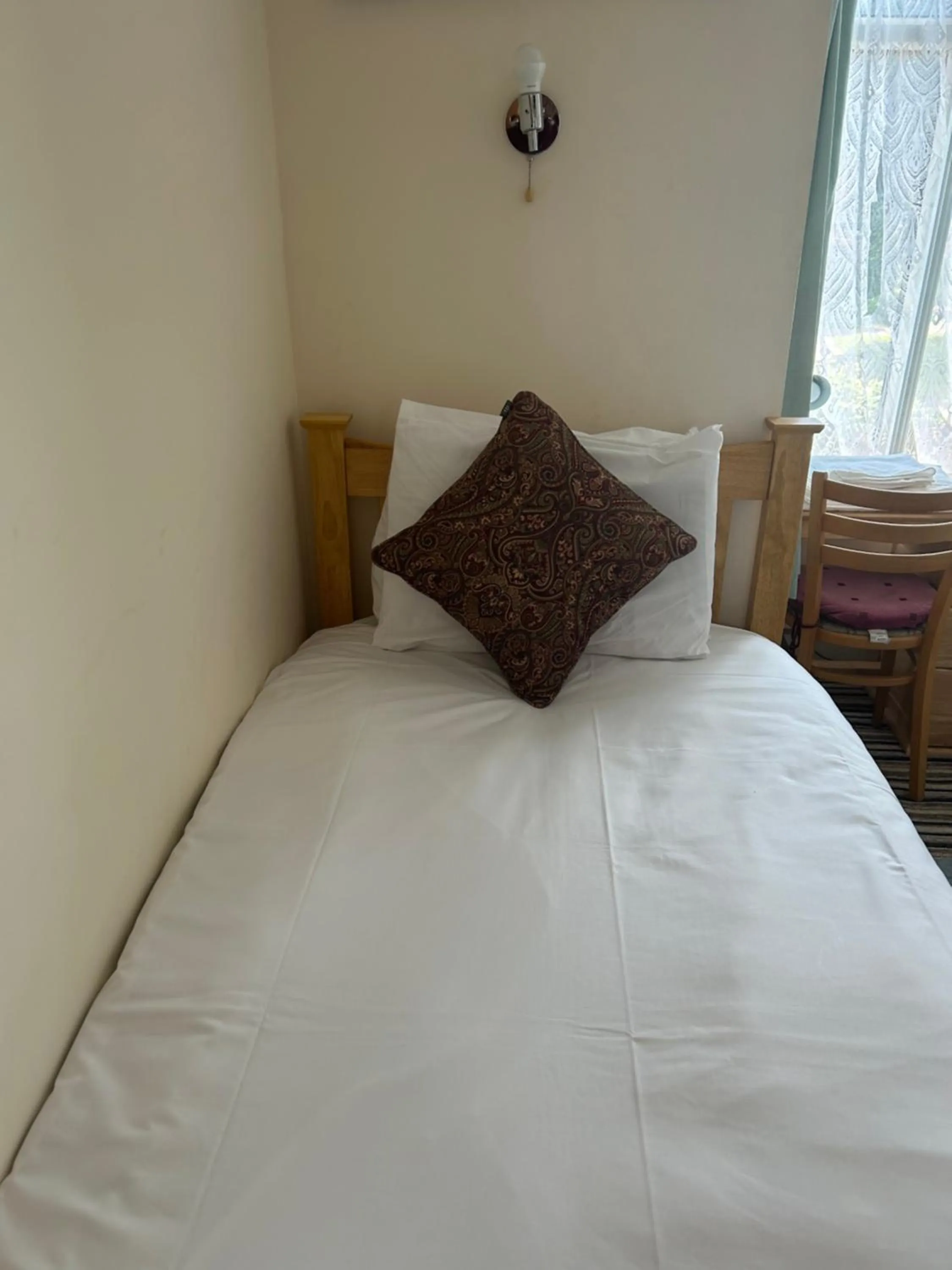 Bed in Four Seasons Guest House