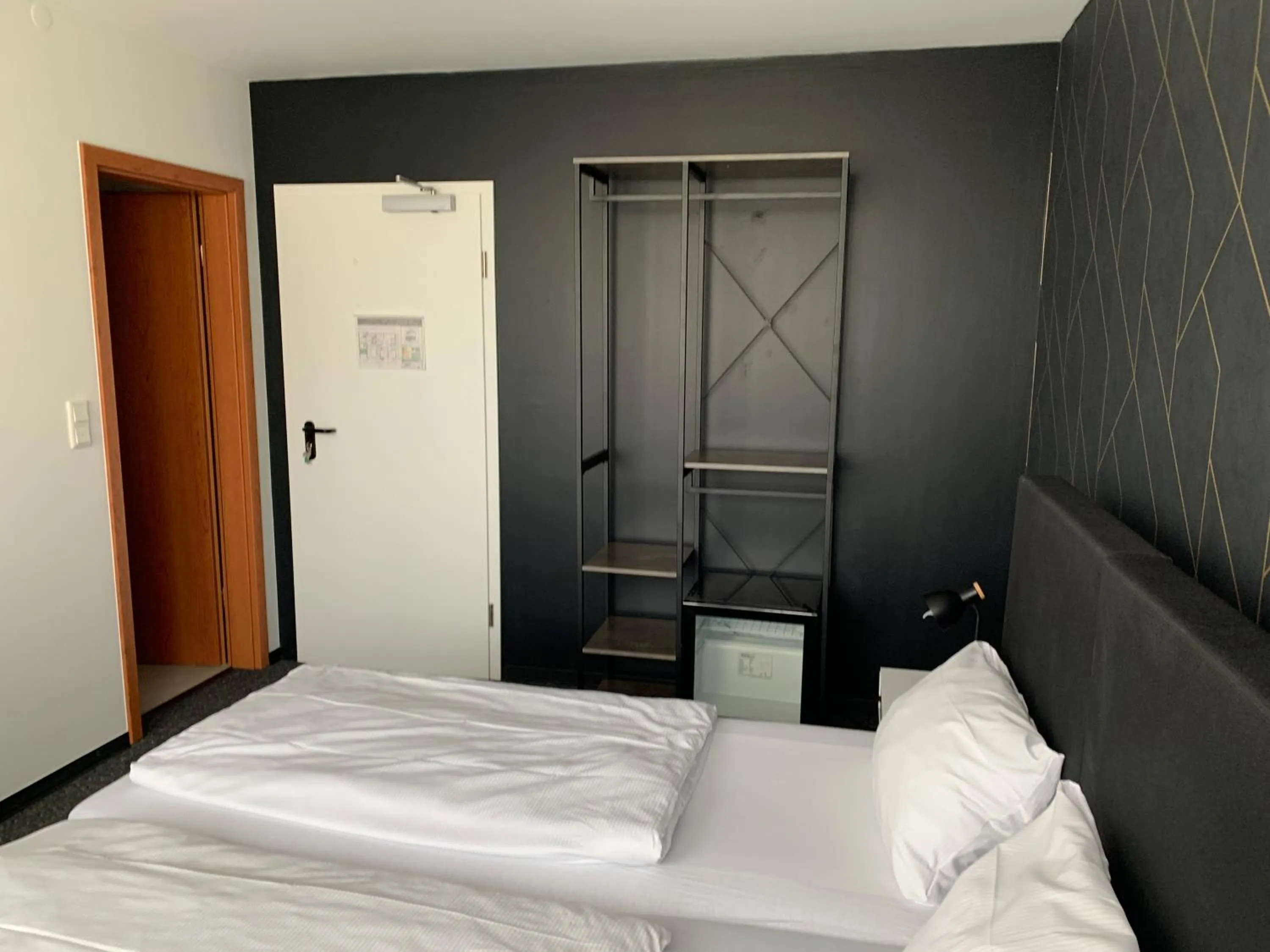 Bed in MOTELO Bielefeld - Smart HOTEL