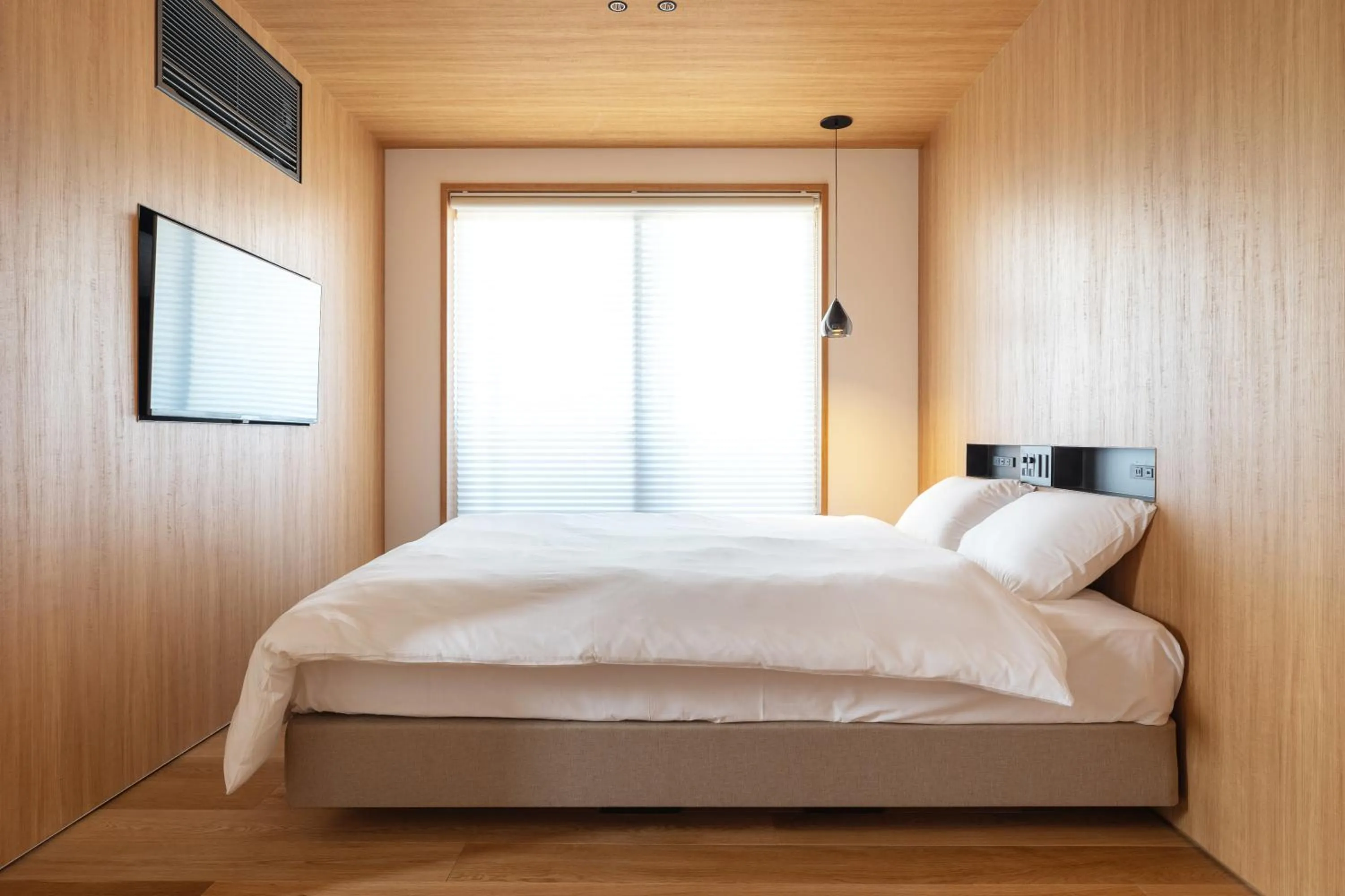 Bed in Karasuma Rokujo Hotel