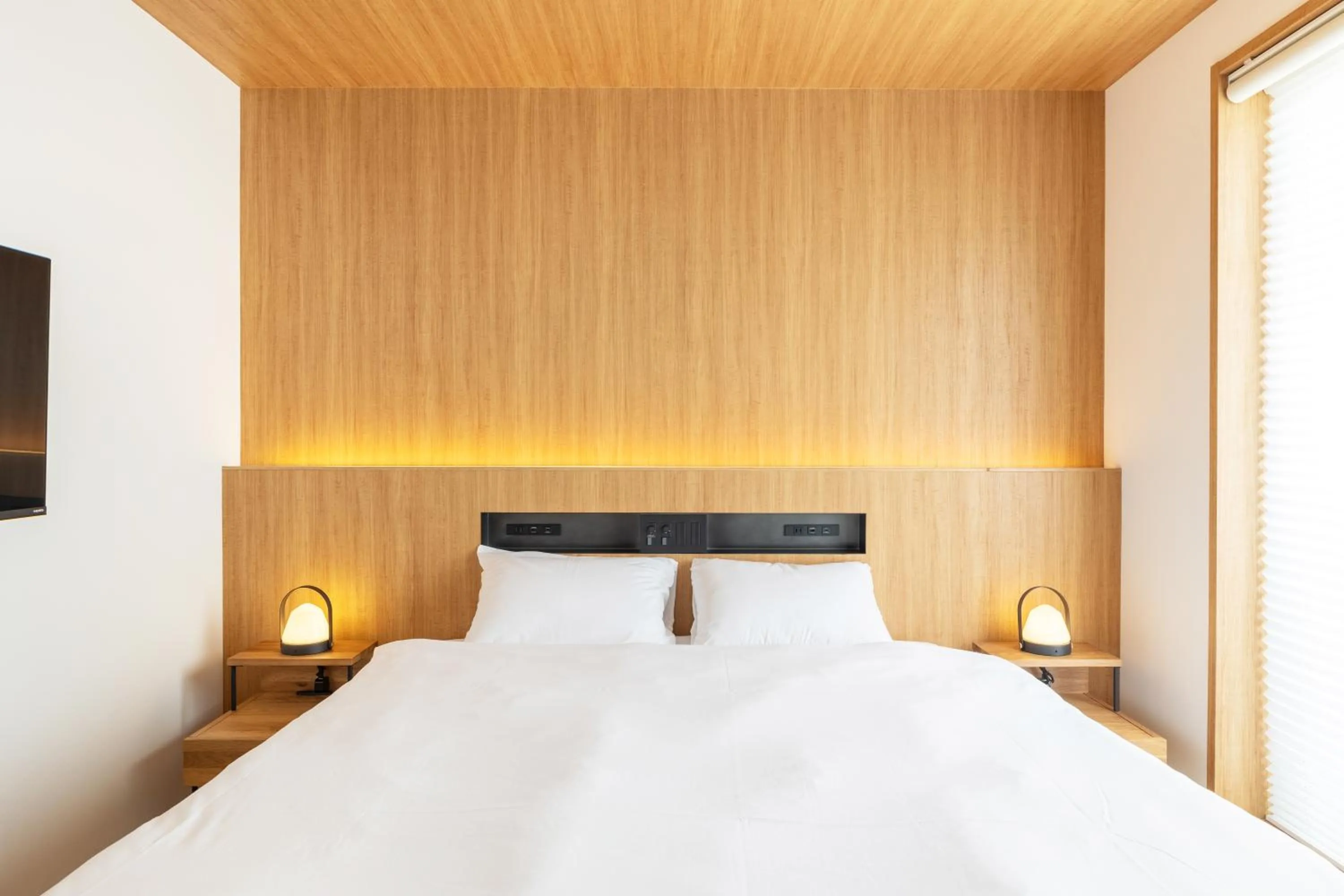 Bed in Karasuma Rokujo Hotel