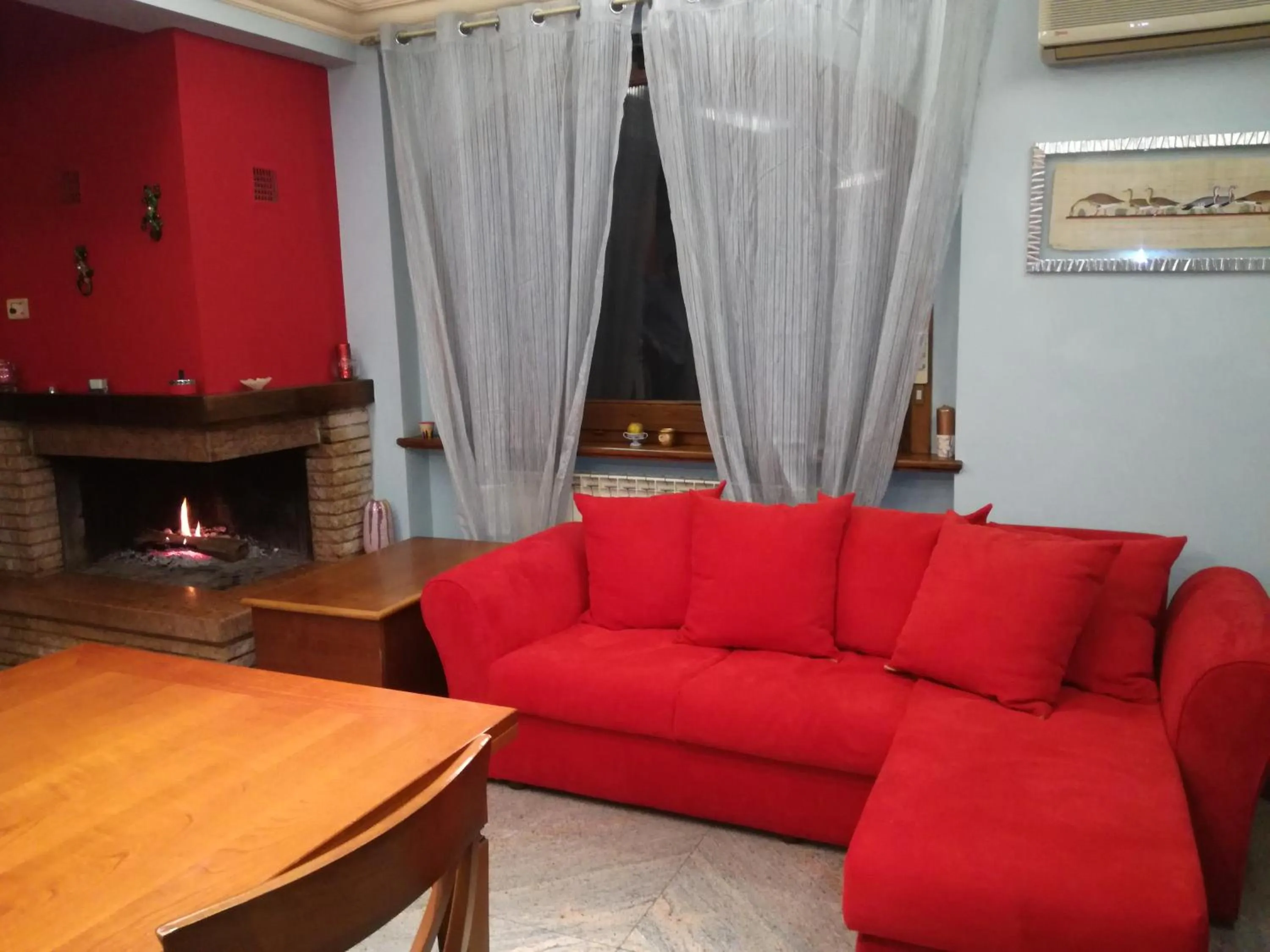 Communal lounge/ TV room in B&B Villa Roberta