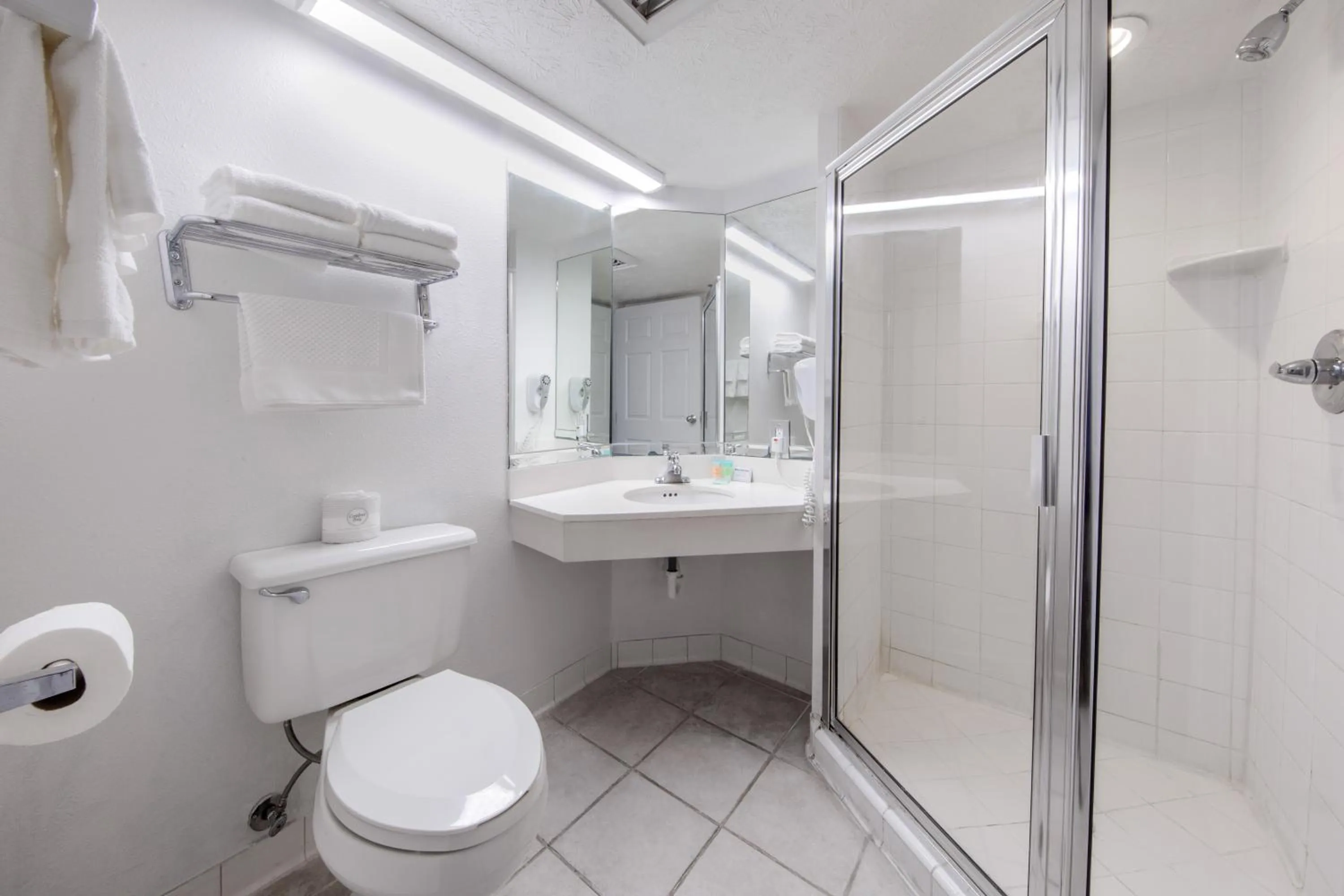 Shower in Beachcomber Beachfront Hotel, a By The Sea Resort