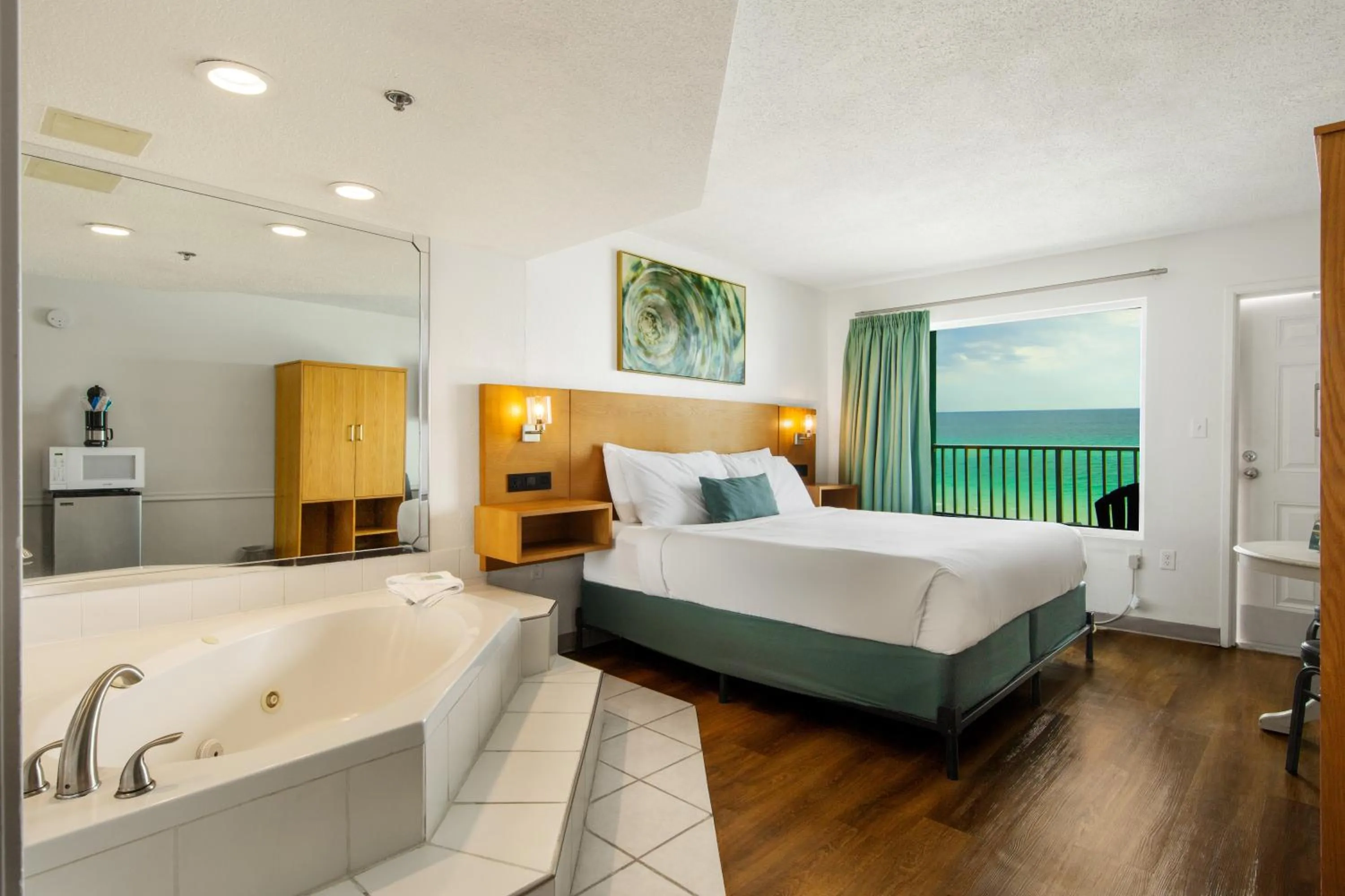 Bed in Beachcomber Beachfront Hotel, a By The Sea Resort