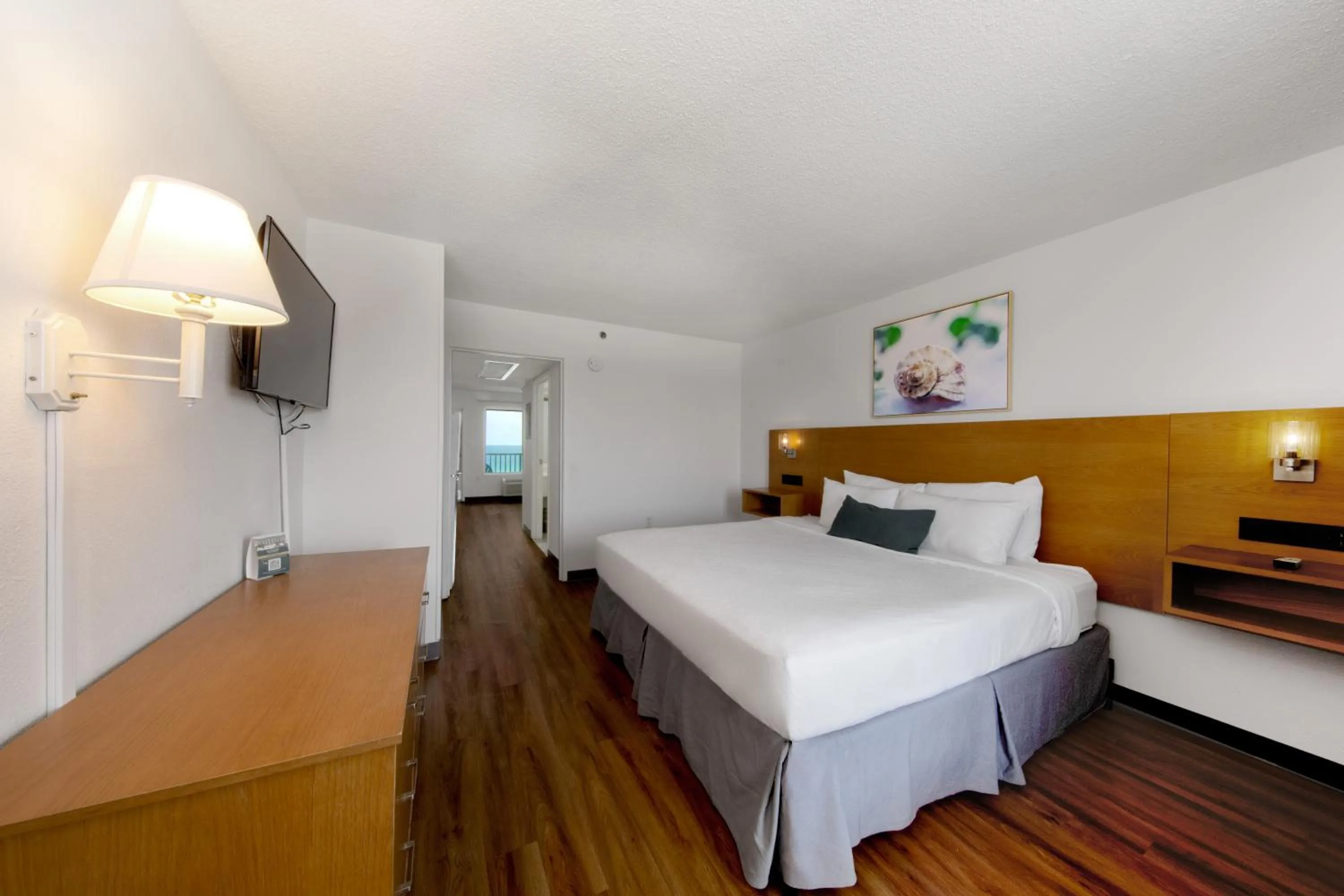 Bed in Beachcomber Beachfront Hotel, a By The Sea Resort