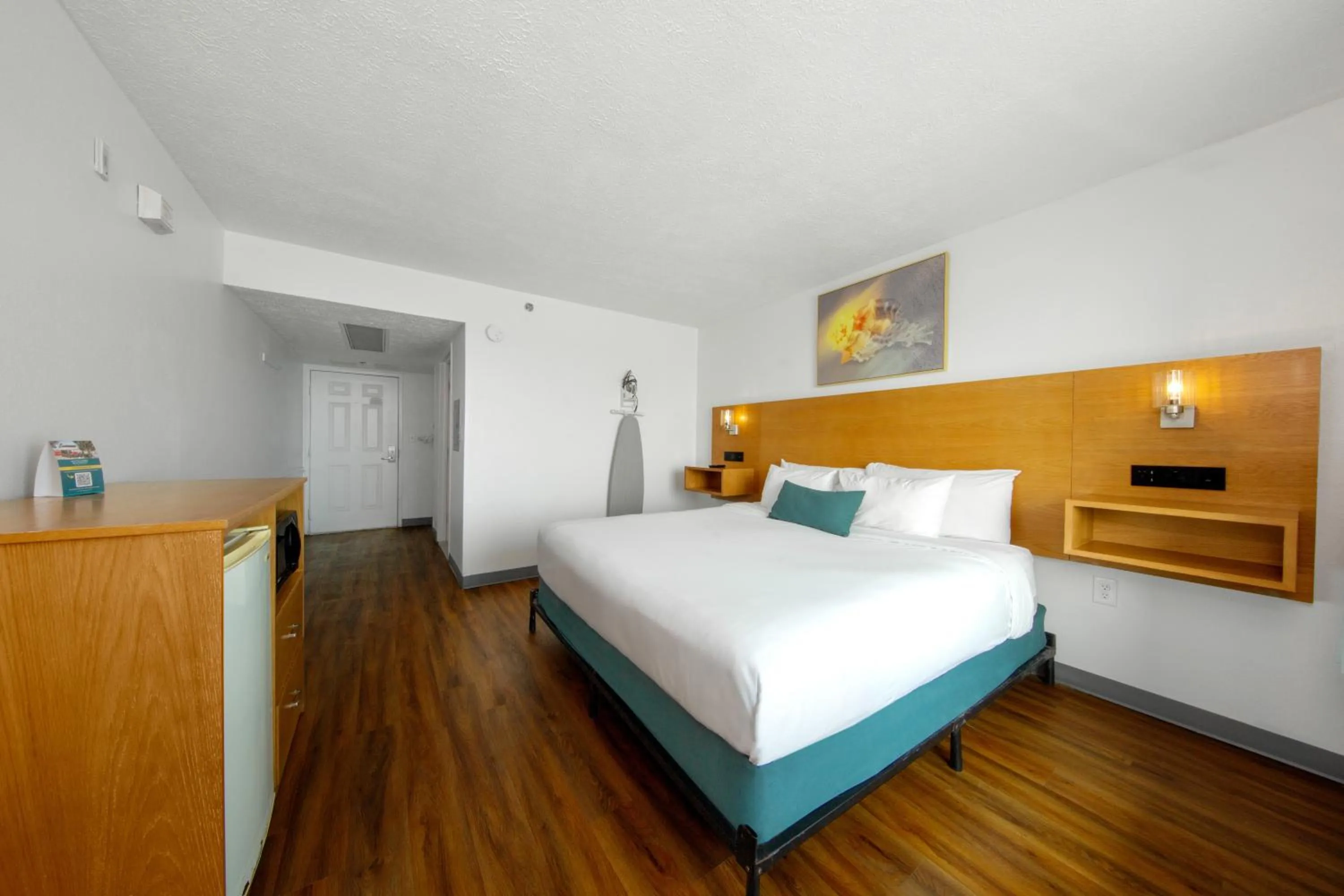 Bed in Beachcomber Beachfront Hotel, a By The Sea Resort