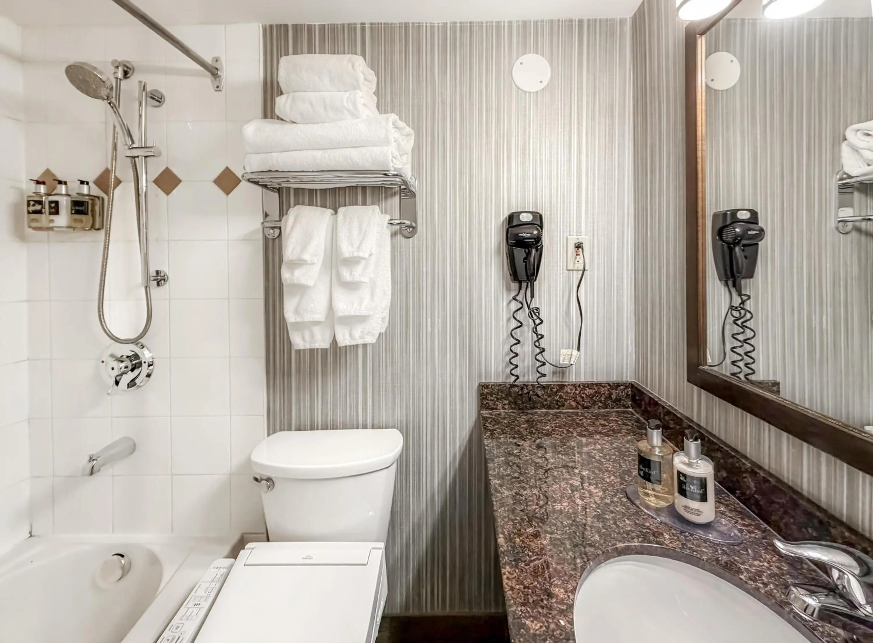 Bathroom in Coast Calgary Downtown Hotel & Suites by APA