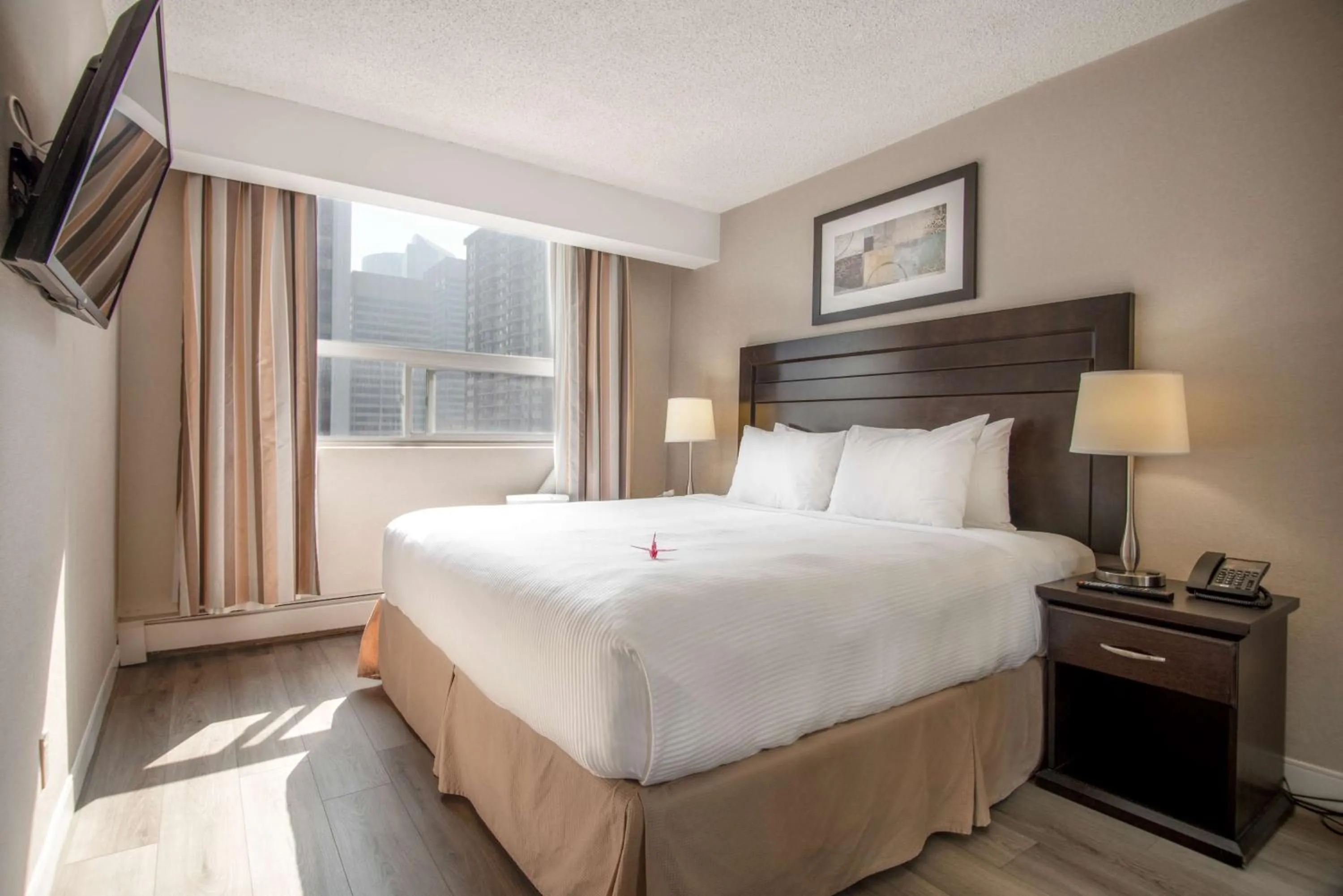 Bed in Coast Calgary Downtown Hotel & Suites by APA