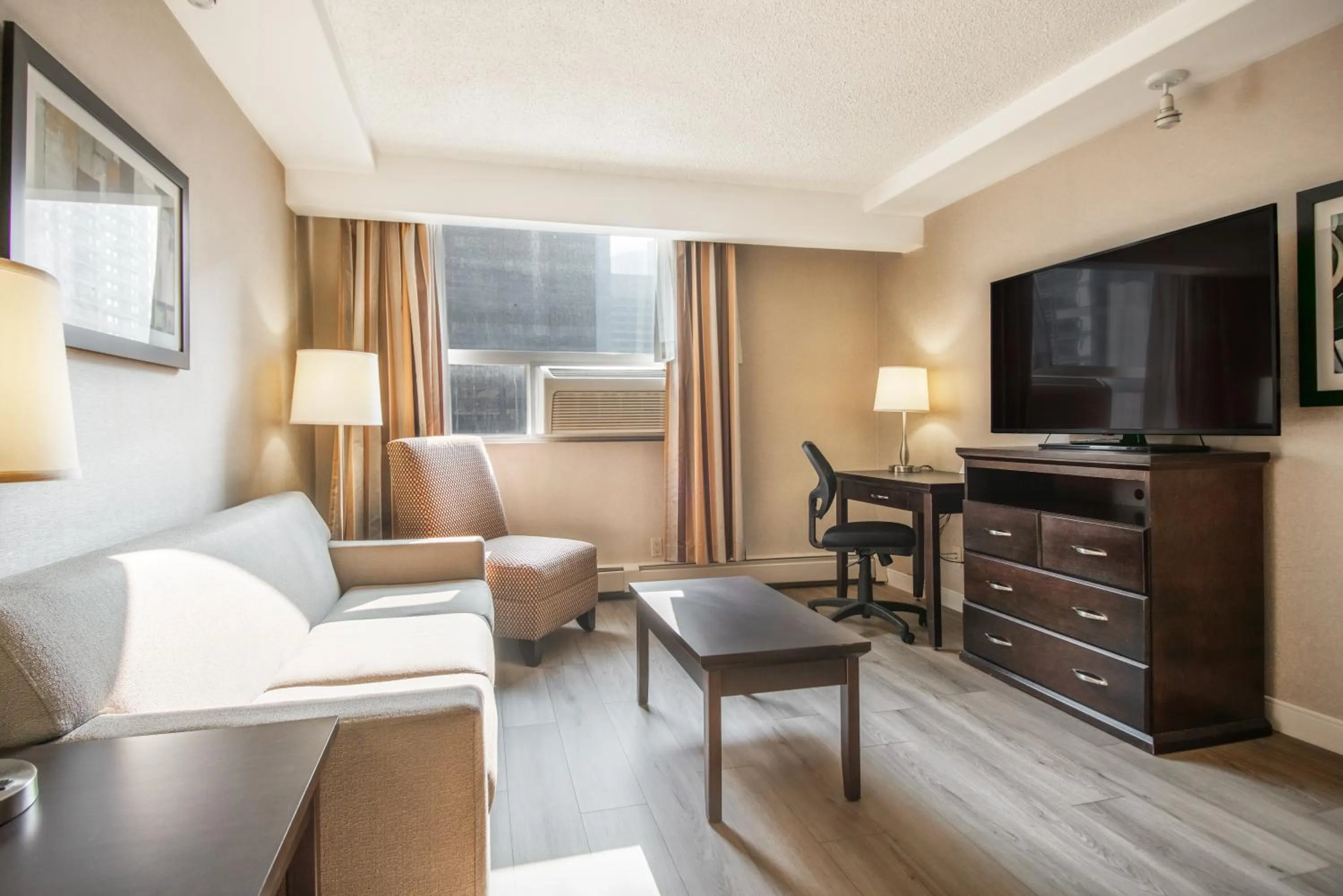 Living room in Coast Calgary Downtown Hotel & Suites by APA