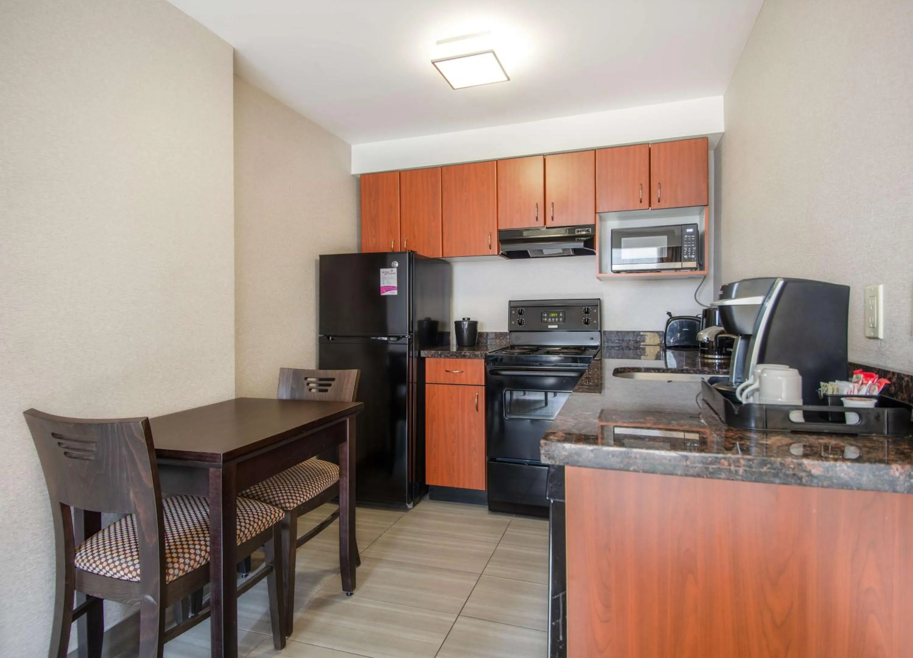 Kitchen or kitchenette in Coast Calgary Downtown Hotel & Suites by APA