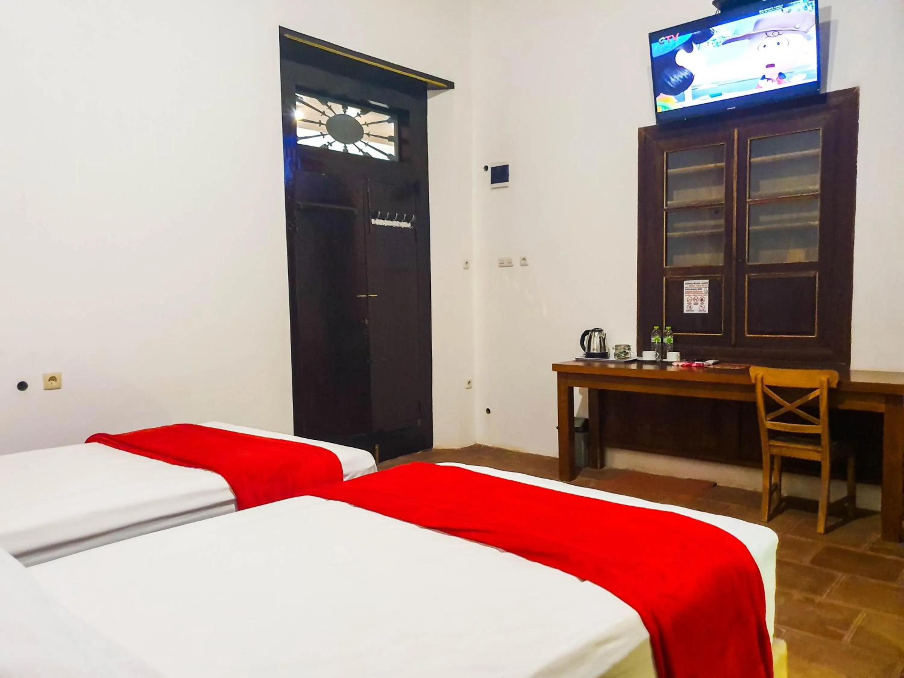 Communal lounge/ TV room, Bed in Tiongkok Kecil Heritage Lasem